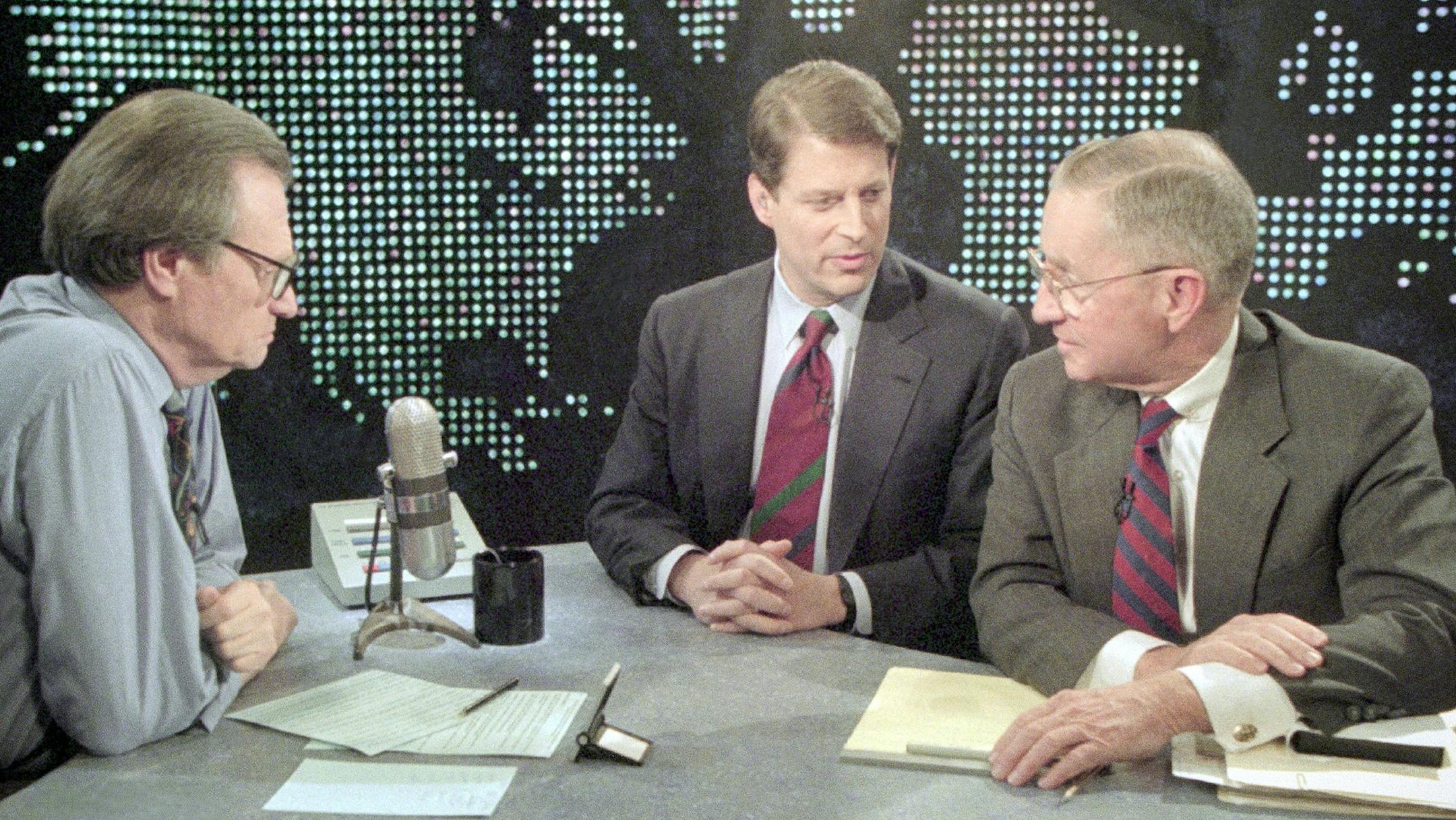 Vice President Al Gore and Ross Perot talk with television talk host Larry King during a break on CNN&#x201a;&#xc4;&#xf4;s &#x201a;&#xc4;&#xfa;Larry King Live&#x201a;&#xc4;&#xf9; show in Washington, on Tuesday, Nov. 9, 1993, where Gore and Perot debated the North American Free Trade Agreement. Gore said that Perot would profit from the defeat of NAFTA. (AP Photo/George Bennet) ORG XMIT: APHS178153