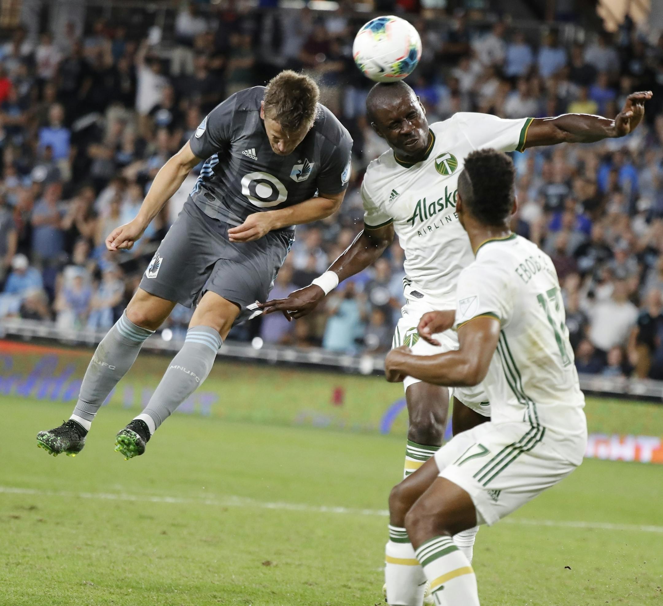 Minnesota United midfielder Robin Lod (16) and Portland Timbers defender Larrys Mabiala (33) battled during the second half.
