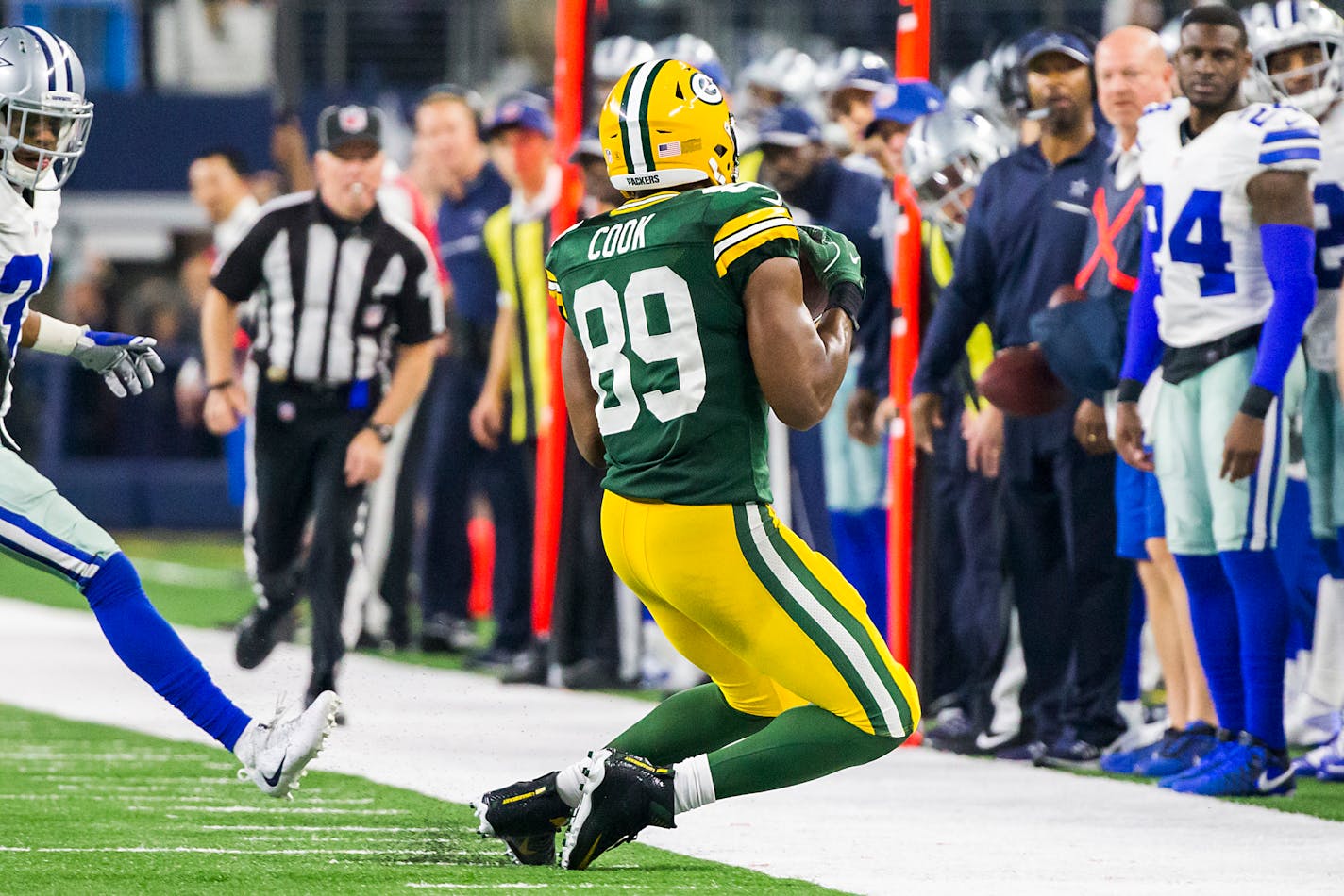 Green Bay tight end Jared Cook dug his toes into the turf — in bounds — on a 36-yard sideline catch with three seconds left that was confirmed by review. The Packers won the game on the next play.