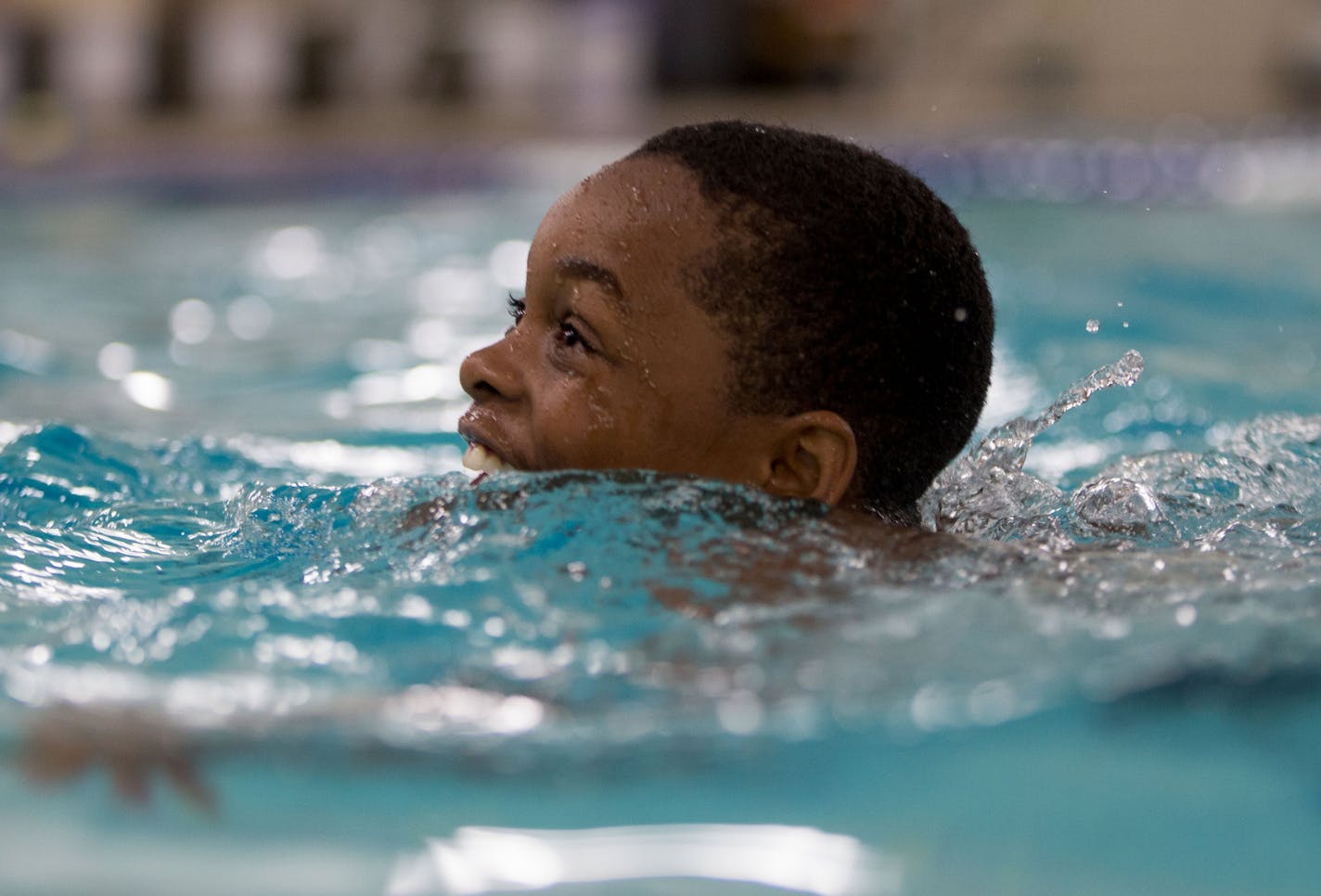 A swim student laughs as he tries to tread on his own for the first time in the deep end of the pool. ] ALEX KORMANN • alex.kormann@startribune.com Statistics show that children of color are at a greater risk of drowning than white children. However, there are multiple programs throughout Minnesota helping to combat the dangers of swimming. One of these programs is at the Blaisdell YMCA in Minneapolis where they introduce water safety and survival techniques into basic swim lessons.