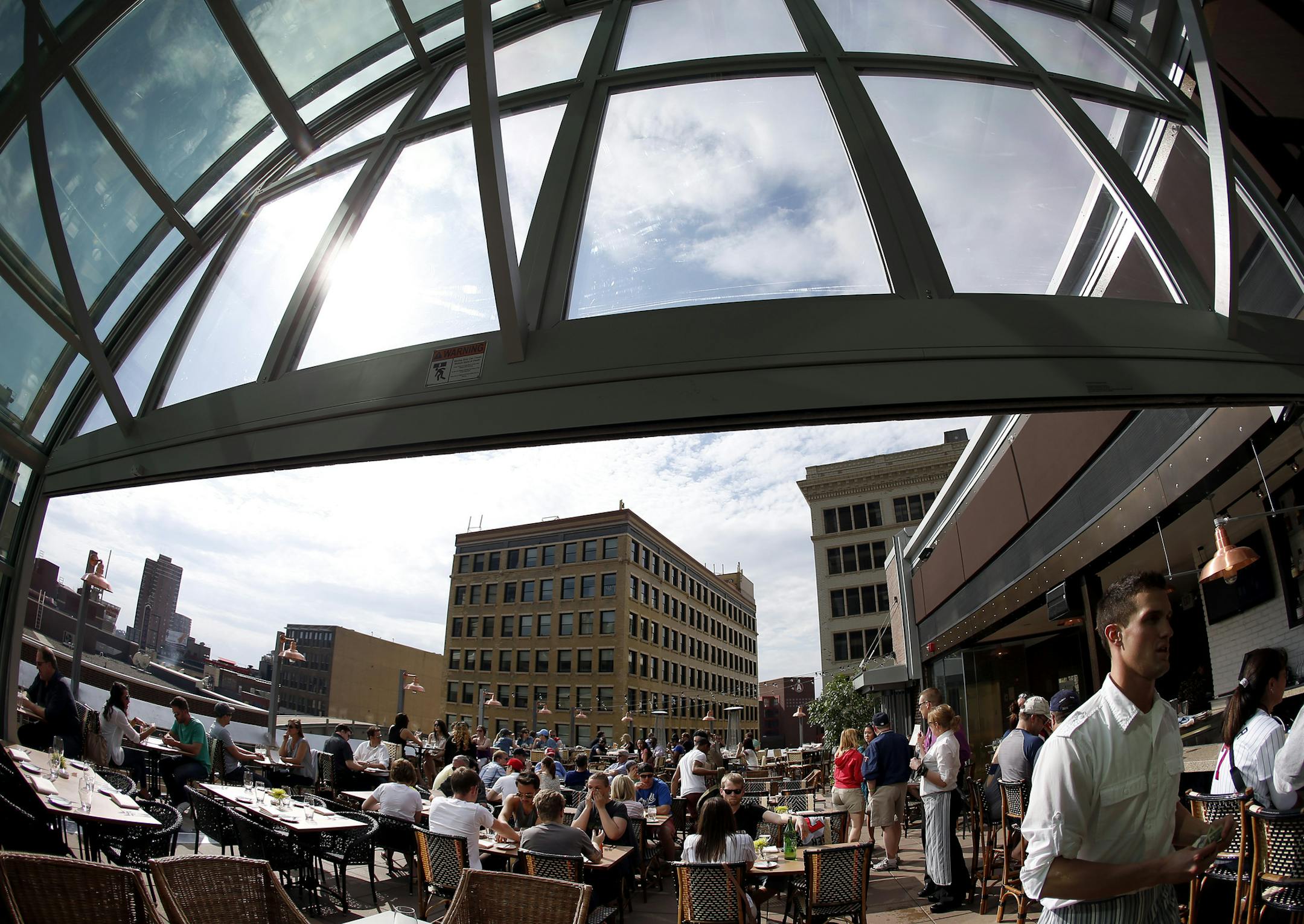 Patrons on the rooftop patio at Union in downtown Minneapolis, Minn. ] CARLOS GONZALEZ cgonzalez@startribune.com April 28, 2013, Minneapolis, Spring Park, Minn., Outdoor Patios, Vita.mn, Lord Fletchers, Psycho Suzi's Motor Lounge, Union