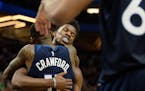 Wolves star Jimmy Butler, celebrating here after a win with Jamal Crawford, is among league leaders in minutes played this season — leading to moans