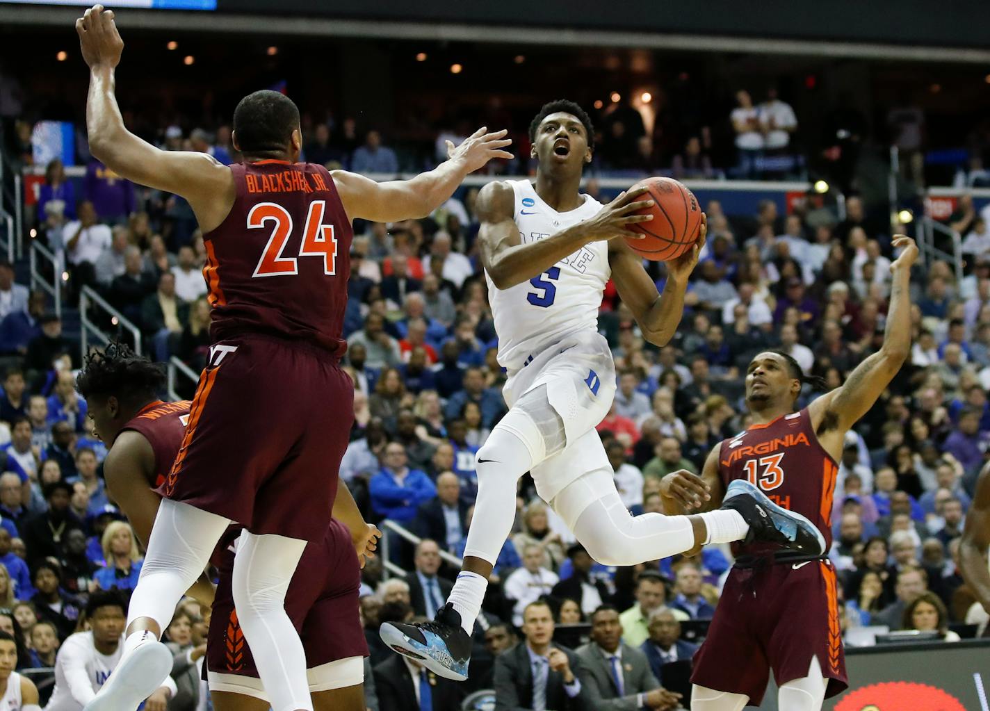 Duke forward RJ Barrett drives to the basket past Virginia Tech forward Kerry Blackshear Jr.