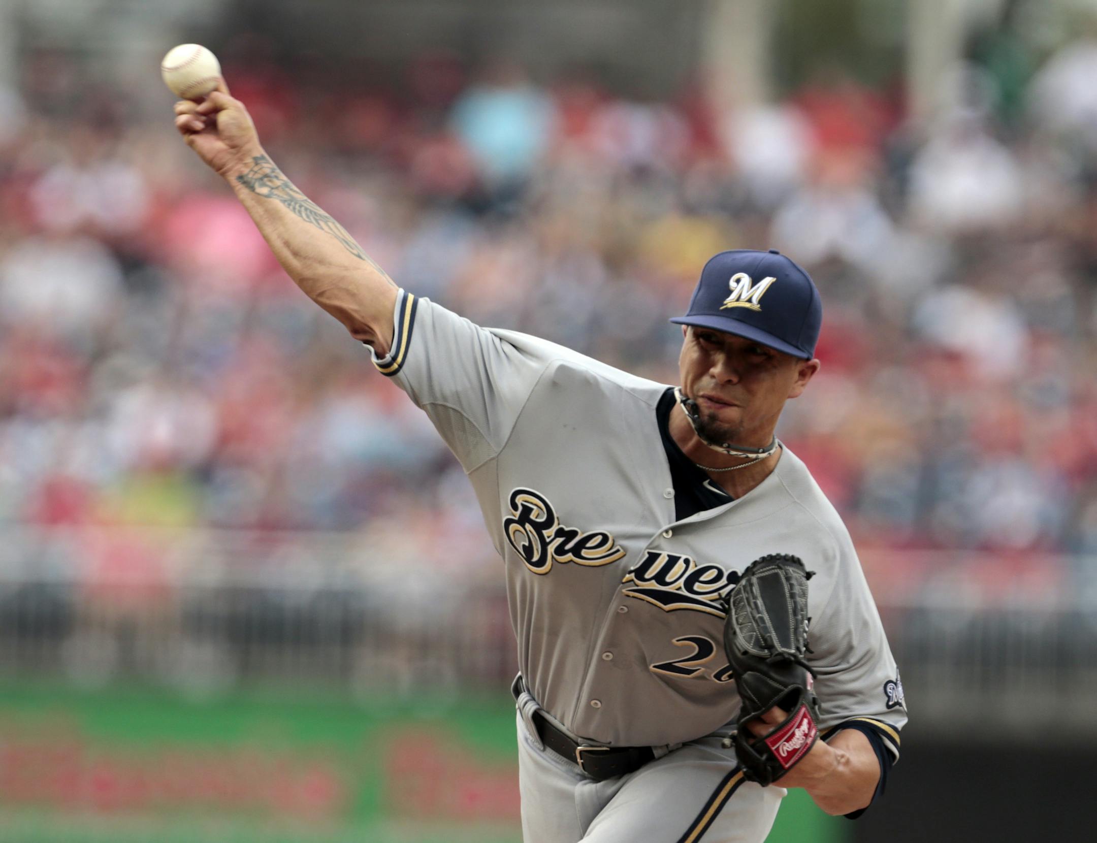 Milwaukee Brewers starting pitcher Kyle Lohse throws during the first inning of a baseball game against the Washington Nationals at Nationals Park, Wednesday, July 3, 2013, in Washington. (AP Photo/Alex Brandon) ORG XMIT: MIN2013070320174885