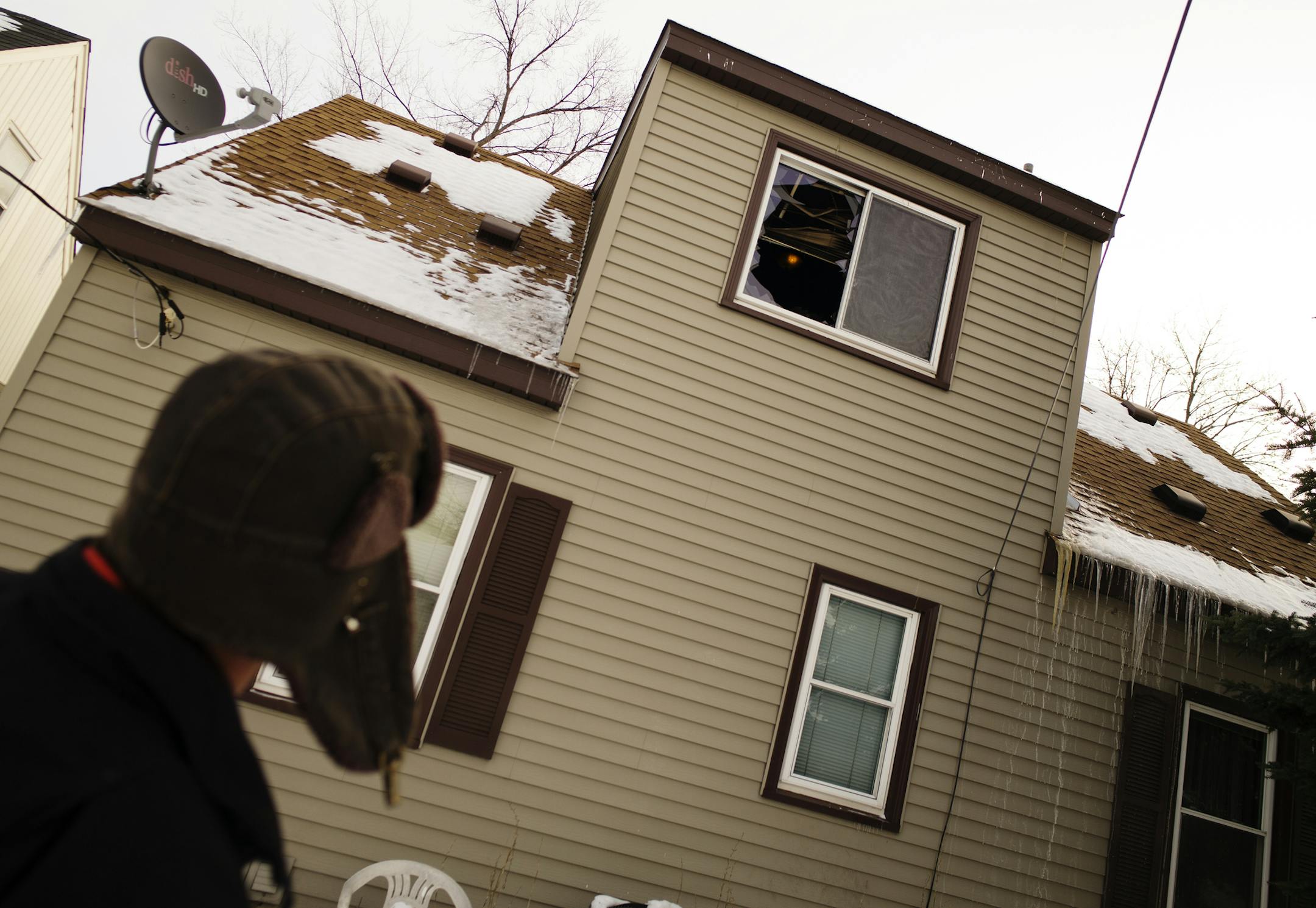 Disaster inspector Ray Trevino looked into the house where one person died in a house fire Saturday night in the 4900 block of Logan Avenue N. in Minneapolis. Firefighters arrived at the scene shortly before 9 p.m. to find the house in flames and quickly initiated a rescue of the victim, according to the Minneapolis Fire Department.] Richard Tsong-Taatarii/rtsong-taatarii@startribune.com
