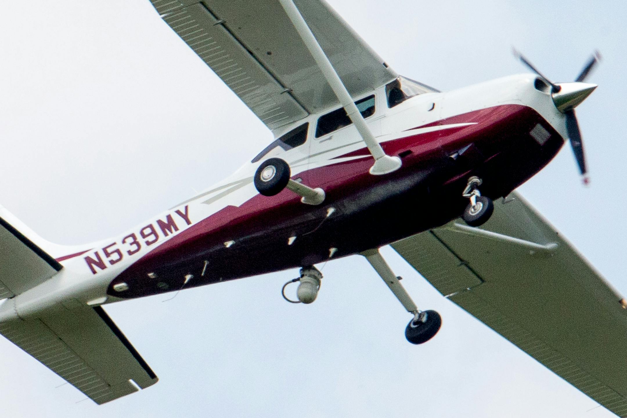 In this photo taken May 26, 2015, a small plane flies near Manassas Regional Airport in Manassas, Va. The plane is among a fleet of surveillance aircraft by the FBI, which are primarily used to target suspects under federal investigation. Such planes are capable of taking video of the ground, and some _ in rare occasions _ can sweep up certain identifying cellphone data. (AP Photo/Andrew Harnik)