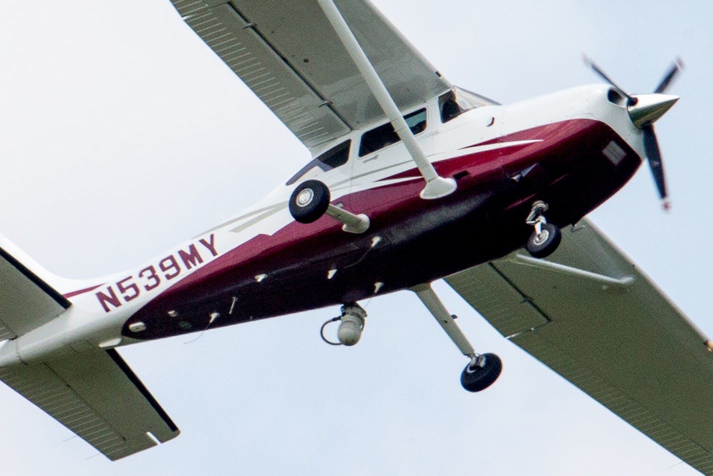 In this photo taken May 26, 2015, a small plane flies near Manassas Regional Airport in Manassas, Va. The plane is among a fleet of surveillance aircraft by the FBI, which are primarily used to target suspects under federal investigation. Such planes are capable of taking video of the ground, and some _ in rare occasions _ can sweep up certain identifying cellphone data. (AP Photo/Andrew Harnik)