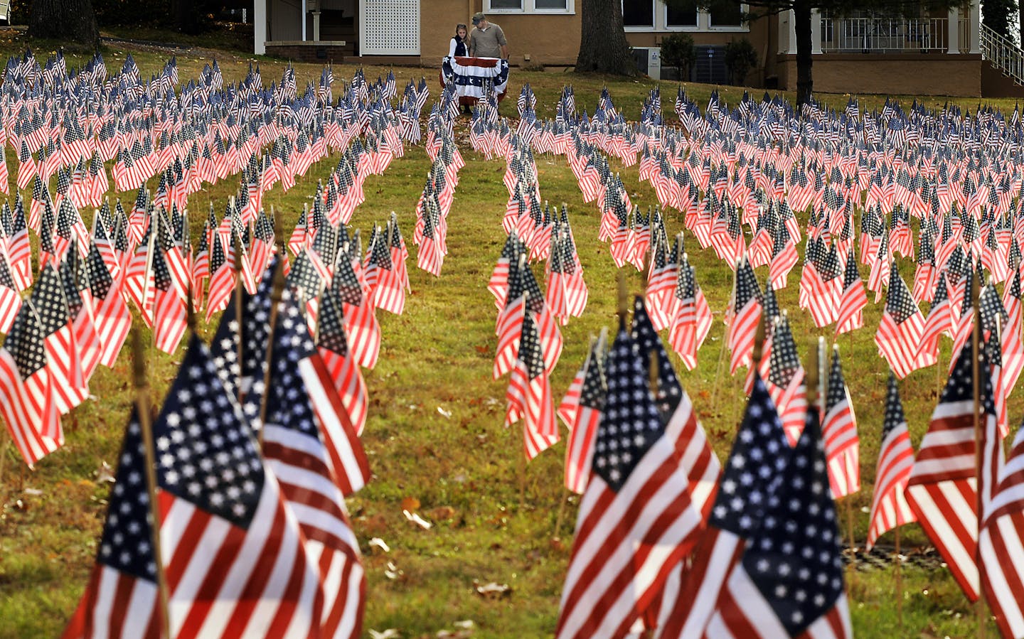 A total of 6,857 U.S. flags are placed on Nov. 9, 2015, at the campus of Marywood University in Scranton, Pa., in memory of the men and women who lost their lives in the wars in Afghanistan and Iraq.