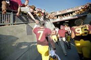 Minnesota's quarterback Mitch Leidner was greeted by fans after their 27-24 victory over Ohio at TCF Bank Stadium, Saturday, September 26, 2015 in Min