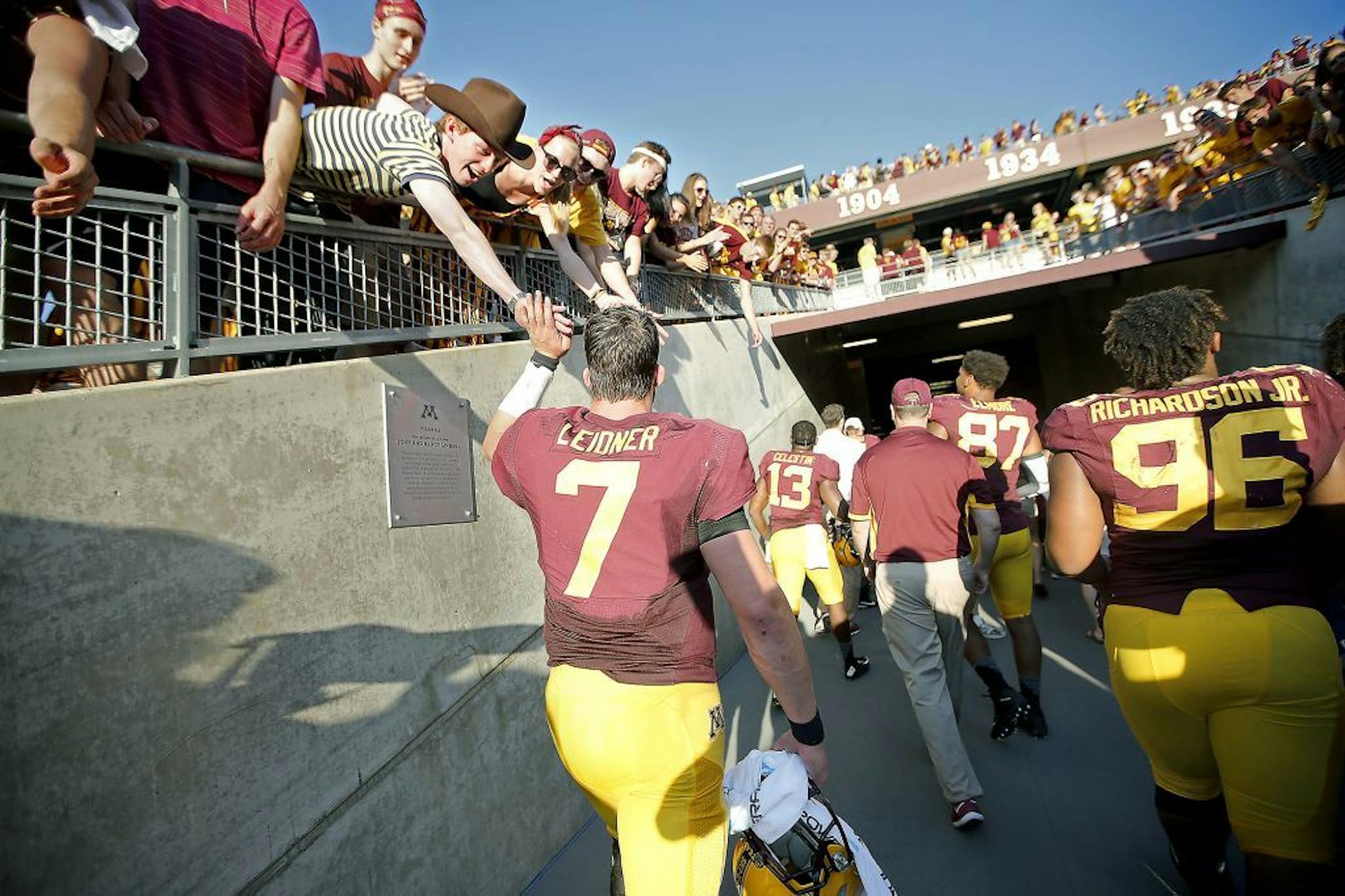 Minnesota's quarterback Mitch Leidner was greeted by fans after their 27-24 victory over Ohio at TCF Bank Stadium, Saturday, September 26, 2015 in Minneapolis, MN.