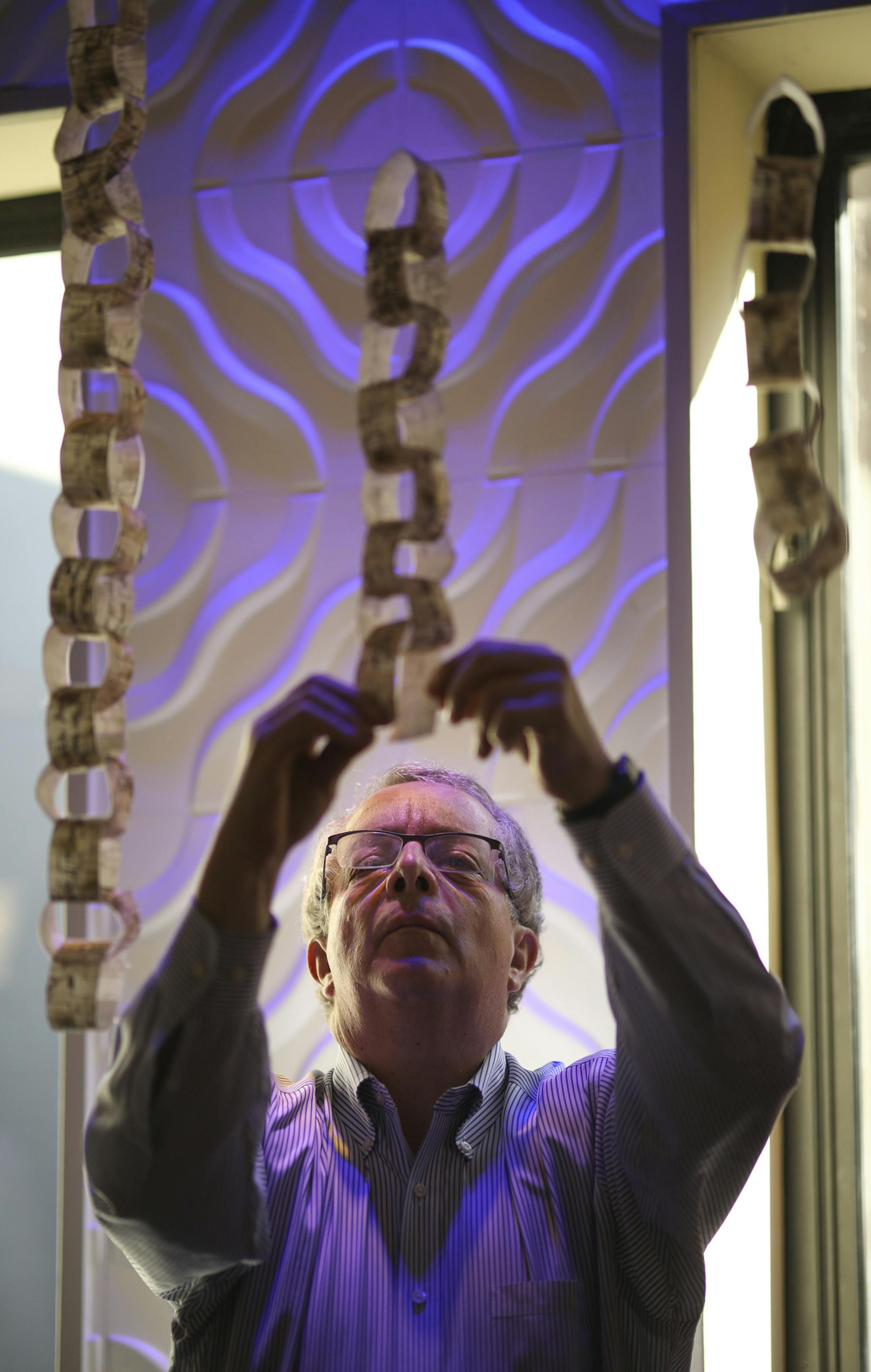 Todd Werner added a prayer for peace to a chain of prayers he was helping to build with others from Adath Jeshurun Congregation of Minnetonka. When finished the chains of prayers written down by attendees at the celebration would be in the shape of a menorah. ] JEFF WHEELER ï jeff.wheeler@startribune.com A community-wide celebration, Israel At 70, was held Sunday afternoon, April 22, 2018 at the Minneapolis Events Center at St. Anthony Main to celebrate the 70th anniversary of Israel's stat