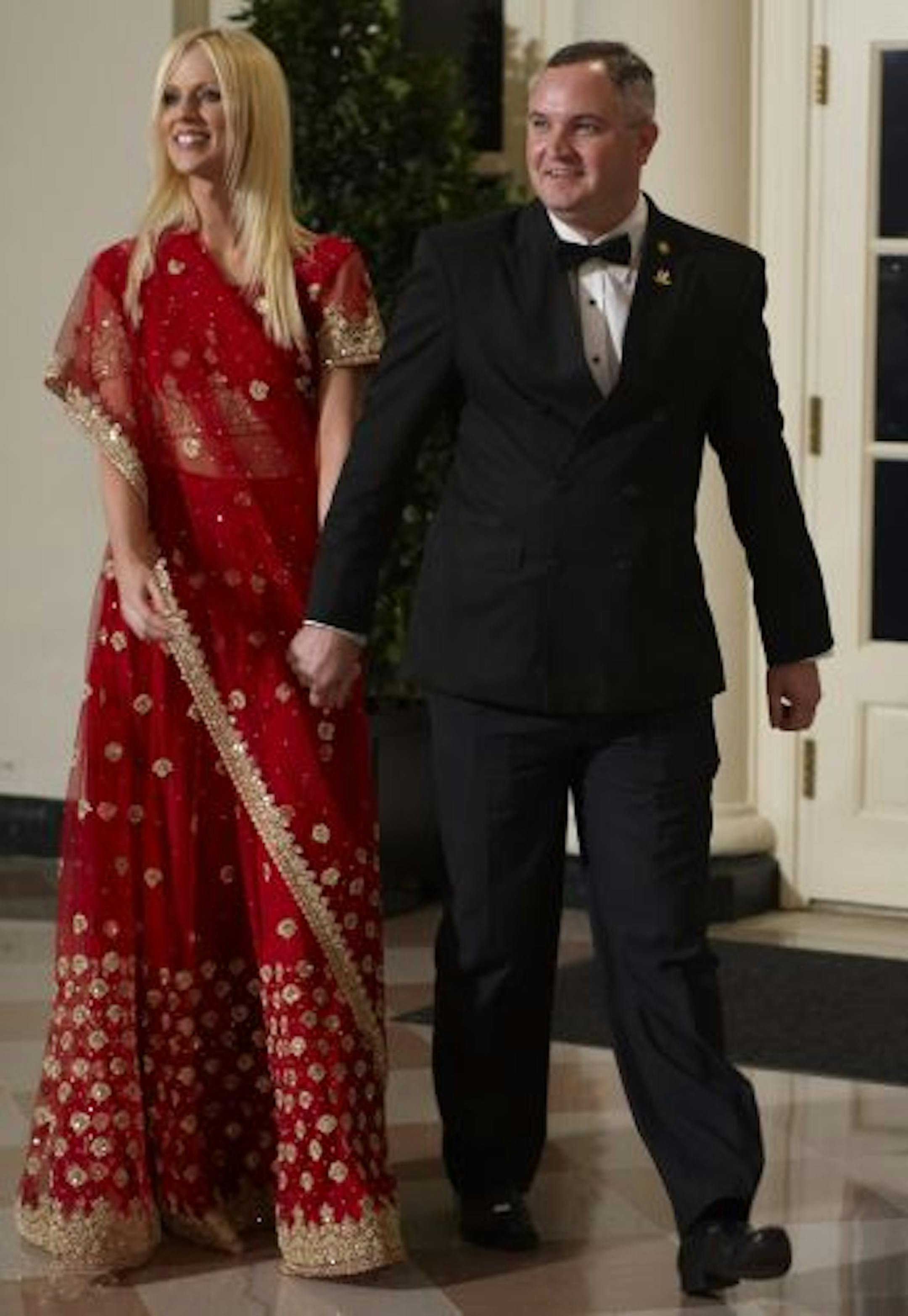 This November 24, 2009 photo shows Tareq Salahi (R) and Michaele Salahi arriving for the State Dinner in honour of India's Prime Minister Manmohan Singh at the Bookseller's area of the White House in Washington, DC. The US Secret Service is checking into it's own security procedues after the Virginia couple, not on the guest list, still managed to slip into the first State Dinner of the Obama administration. AFP PHOTO / Mandel NGAN
