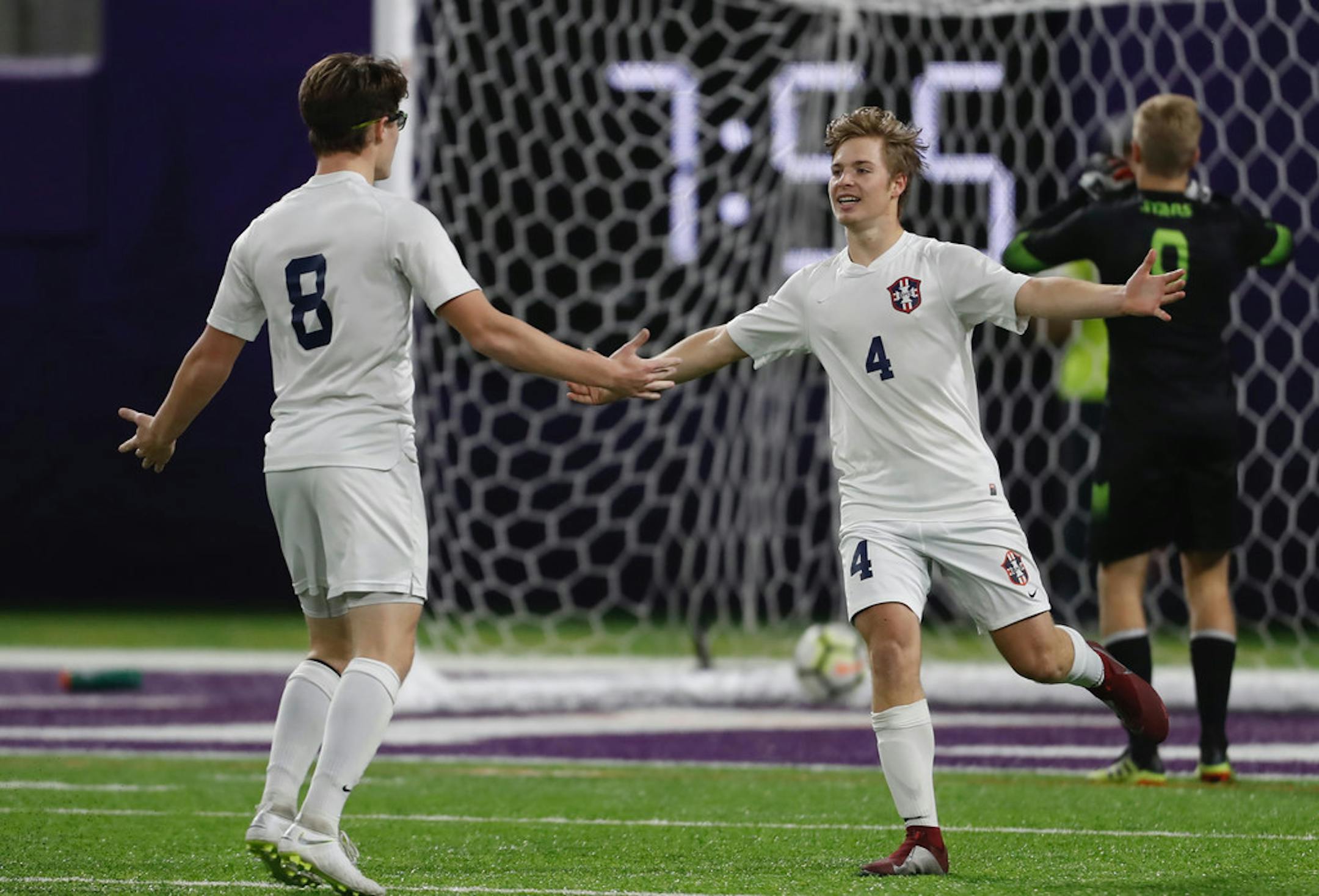 Bemidji's Aidan Helwig (8) and Ethan Mock(4) celebrate Helwig's second goal scored in the Lumberjacks' 3-1 victory over Holy Angels in the Class 1A semifinals Tuesday at U.S. Bank Stadium. Photo: Richard.Tsong-Taatarii * Richard.Tsong-Taatarii@startribune.com.
