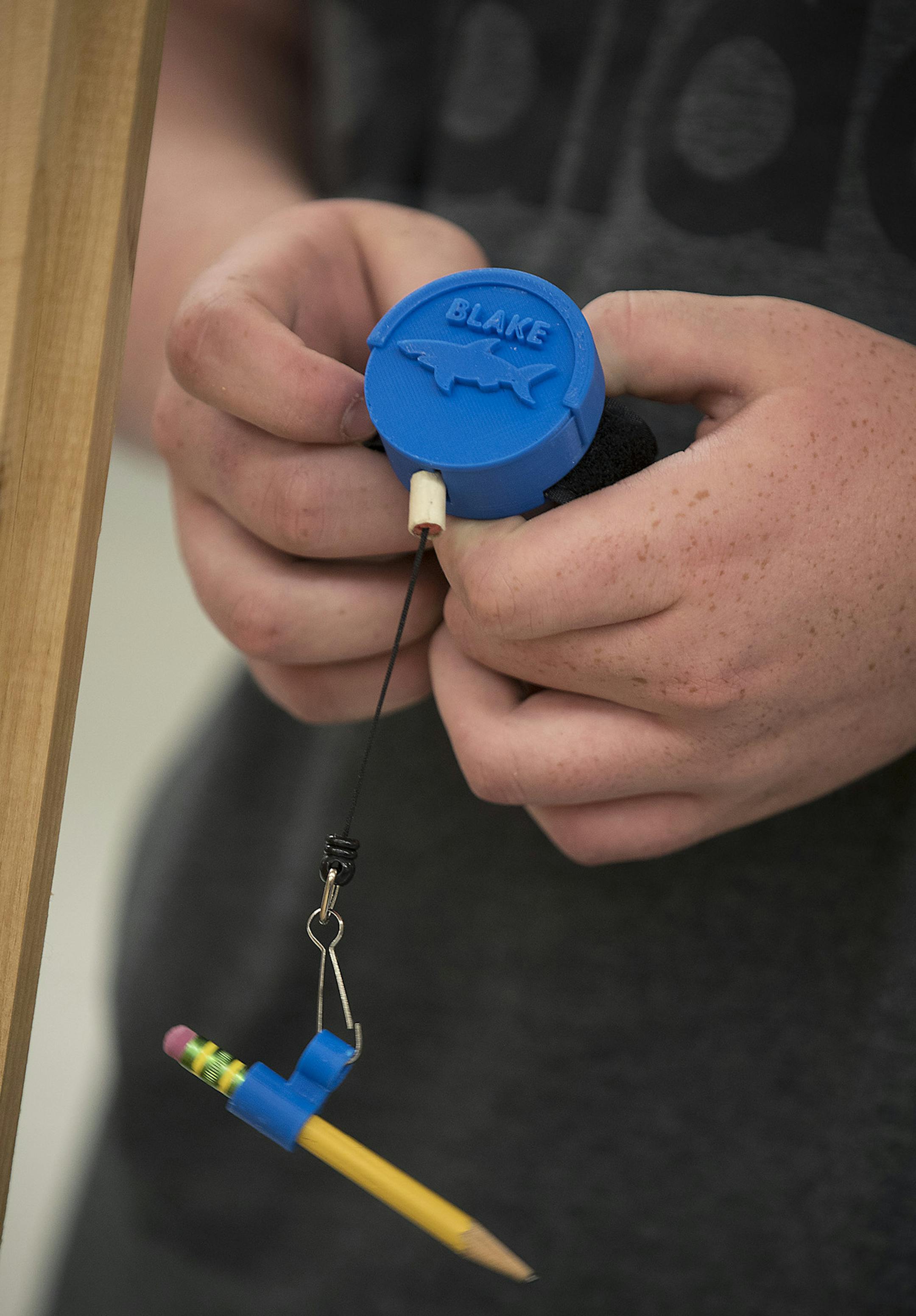 Grant Bain, showed how to use a retractor watch that he invented for a student who is visually impaired at East Junior High School, Tuesday, May 29, 2018 in Shakopee, MN. ] ELIZABETH FLORES &#xef; liz.flores@startribune.com
