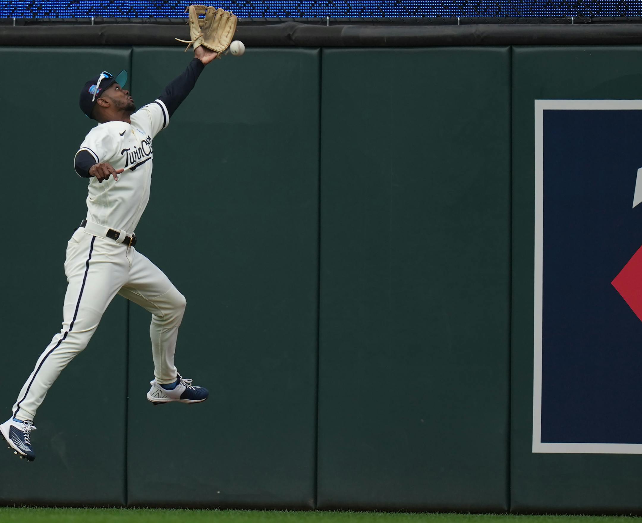 Minnesota Twins center fielder Michael A. Taylor (2) gets close to gloving a double by Detroit Tigers third baseman Andy Ibanez (77) in the second inning.