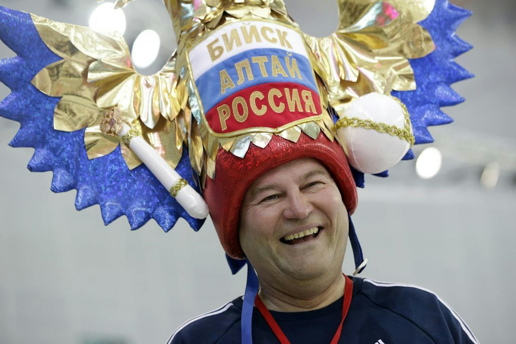 Russian skating fan Andrei Kozlov arrives at the Adler Arena Skating Center to watch the men's 10,000-meter speedskating race during the 2014 Winter Olympics in Sochi, Russia, Tuesday, Feb. 18, 2014.