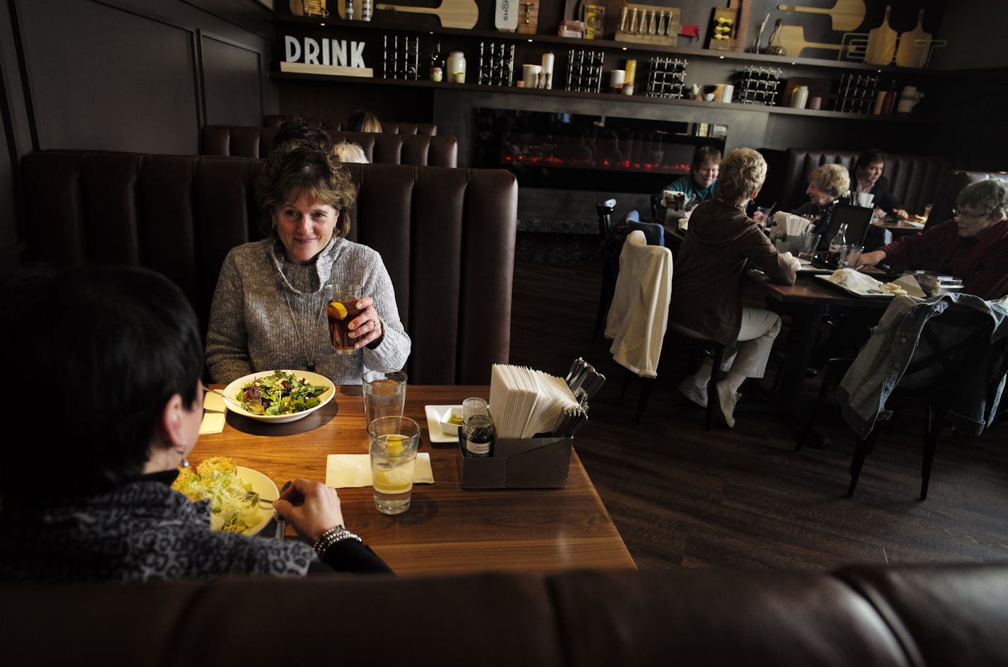 At the Lunds and Byerly's Kitchen in downtown Wayzata, part of the dining area is cozy alcove. Jan Nygren and Jane Ehmke enjoyed some salads.]richard.tsong-taatarii/rtsong-taatarii@startribune.com