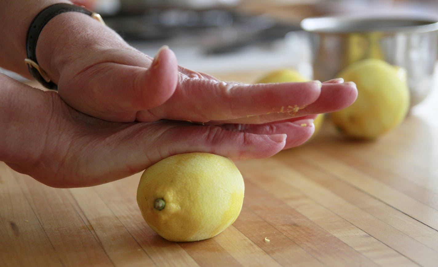 Baking Central - Lemon Lush -in progress shots -after grating the lemon for zest - roll on the contertop under hand pressure to increase the amount of juice ] Tom Sweenet, March 18, 2015, Edina, MN