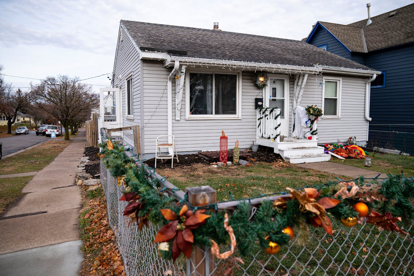 The exterior of a house recently sold to investors for more than the asking price, as seen on Wednesday, Dec. 1, 2021 on Margaret St. in St. Paul. The house is being used as a rental. ]