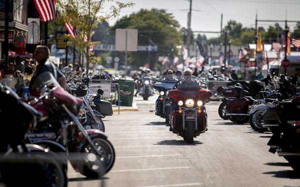 People rode through downtown Sturgis, S.D., during the 80th annual Sturgis Motorcycle Rally on Aug. 10, 2020.