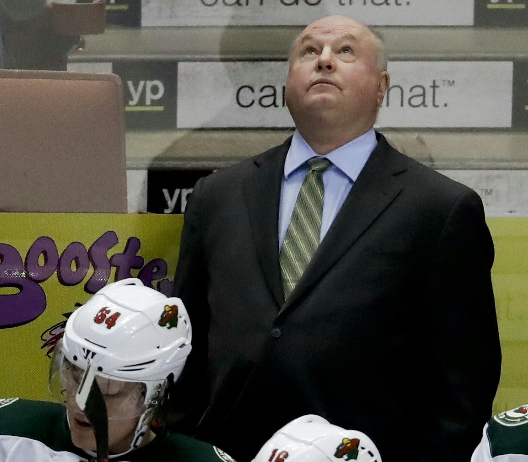 Minnesota Wild coach Bruce Boudreau watches during the third period of an NHL hockey game against the Anaheim Ducks in Anaheim, Calif., Sunday, Jan. 8, 2017. This was the first game back in Anaheim for Boudreau after leaving the Ducks last year. The Wild won 2-1. (AP Photo/Chris Carlson)