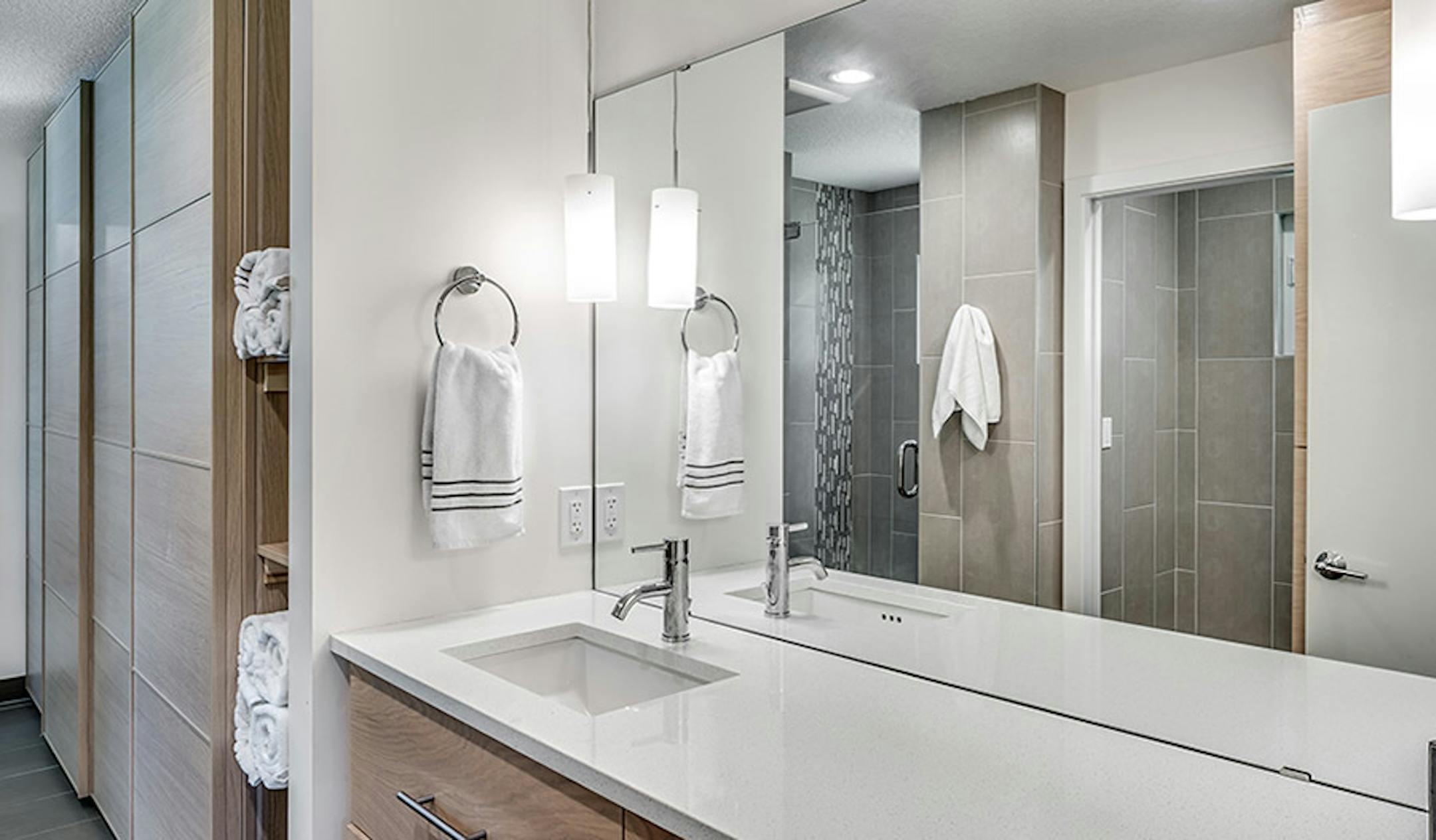 The spa-style owner's bathroom flows into a large walk-in closet.