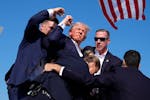 Republican presidential candidate former President Donald Trump is surround by U.S. Secret Service agents at a campaign rally, Saturday, July 13, 2024