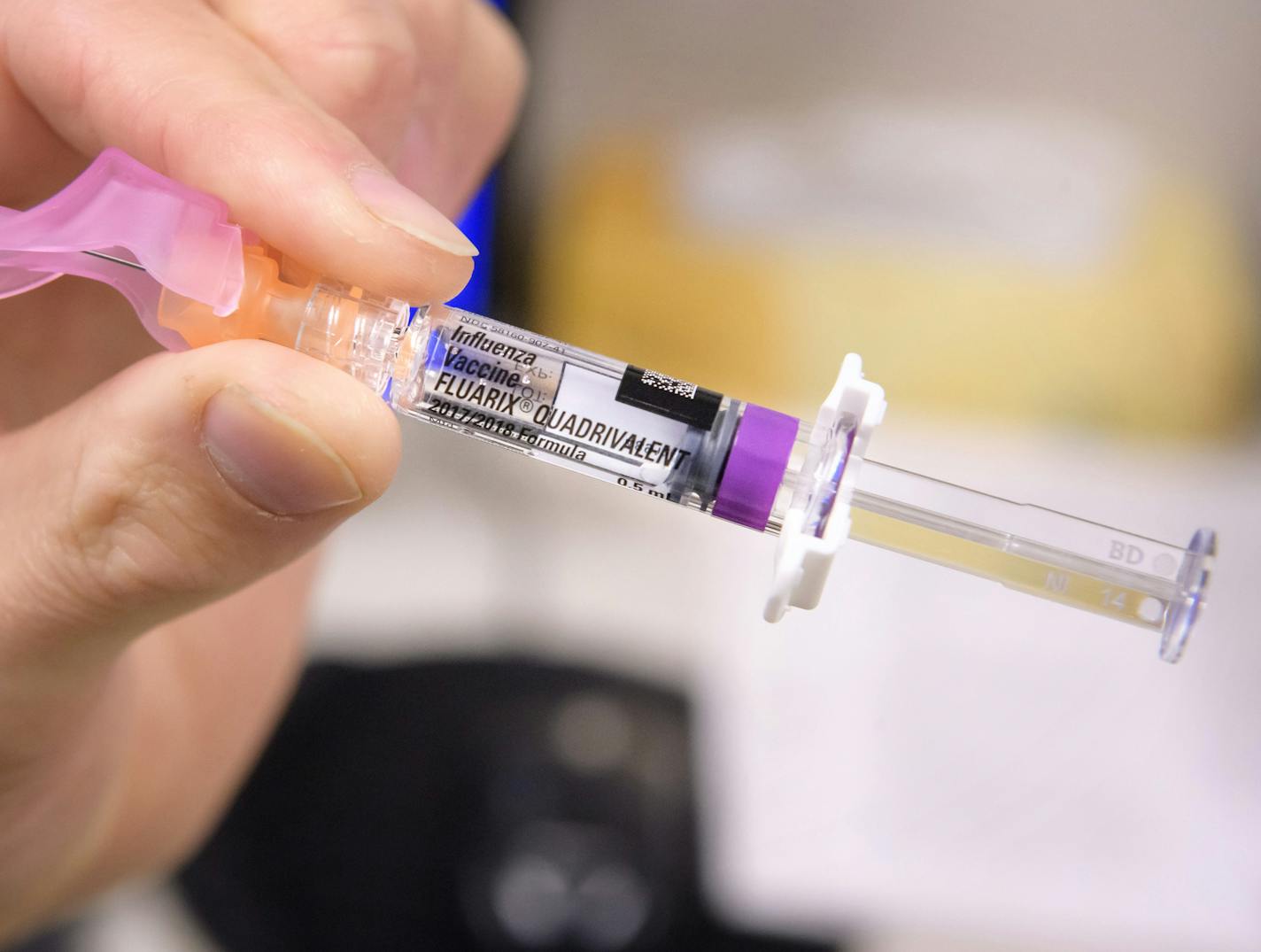 HCMC Chief Cardiologist Dr. Bart Bradley received a flu shot from Josh Gramling, head of employee occupational health at HCMC ] GLEN STUBBE &#xef; glen.stubbe@startribune.com Wednesday, October 25, 2017 HCMC staff are asked to get flu shots and then display a black tag on their ID card to show they received it.