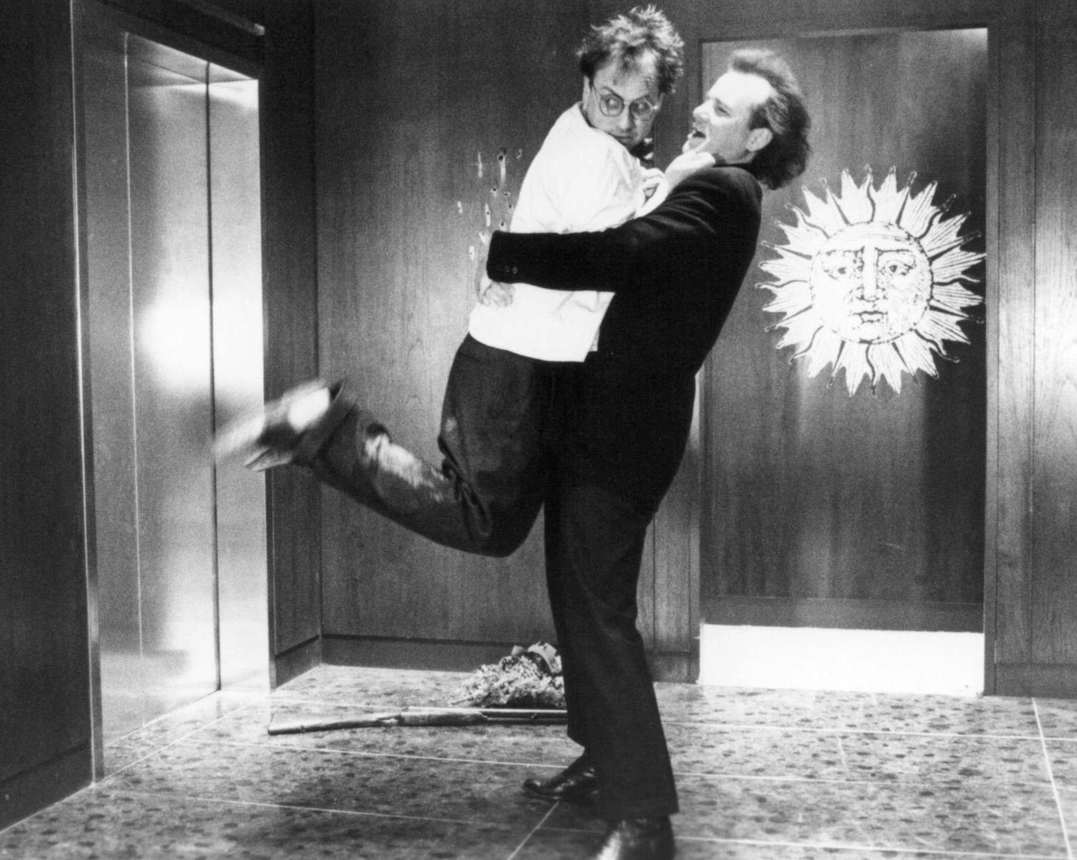 Bobcat Goldthwaite and Bill Murray in "Scrooged"