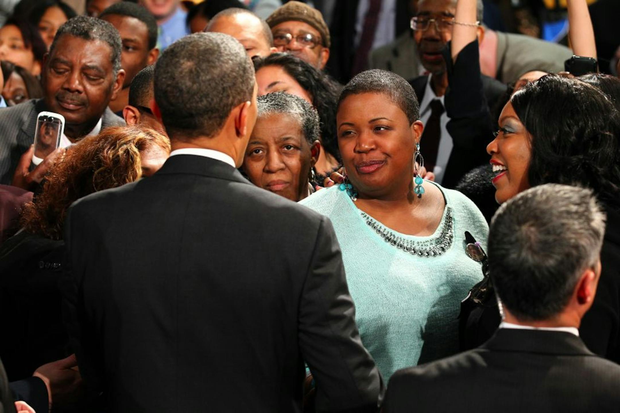 President Obama greeted Cleopatra Cowley-Pendleton, the mother of slain 15-year-old Hadiya Pendleton, as he visited Hyde Park Academy in Chicago on Friday. Hadiya Pendleton was gunned down as she stood with friends after school in a park that is located near Obama's Chicago home.
