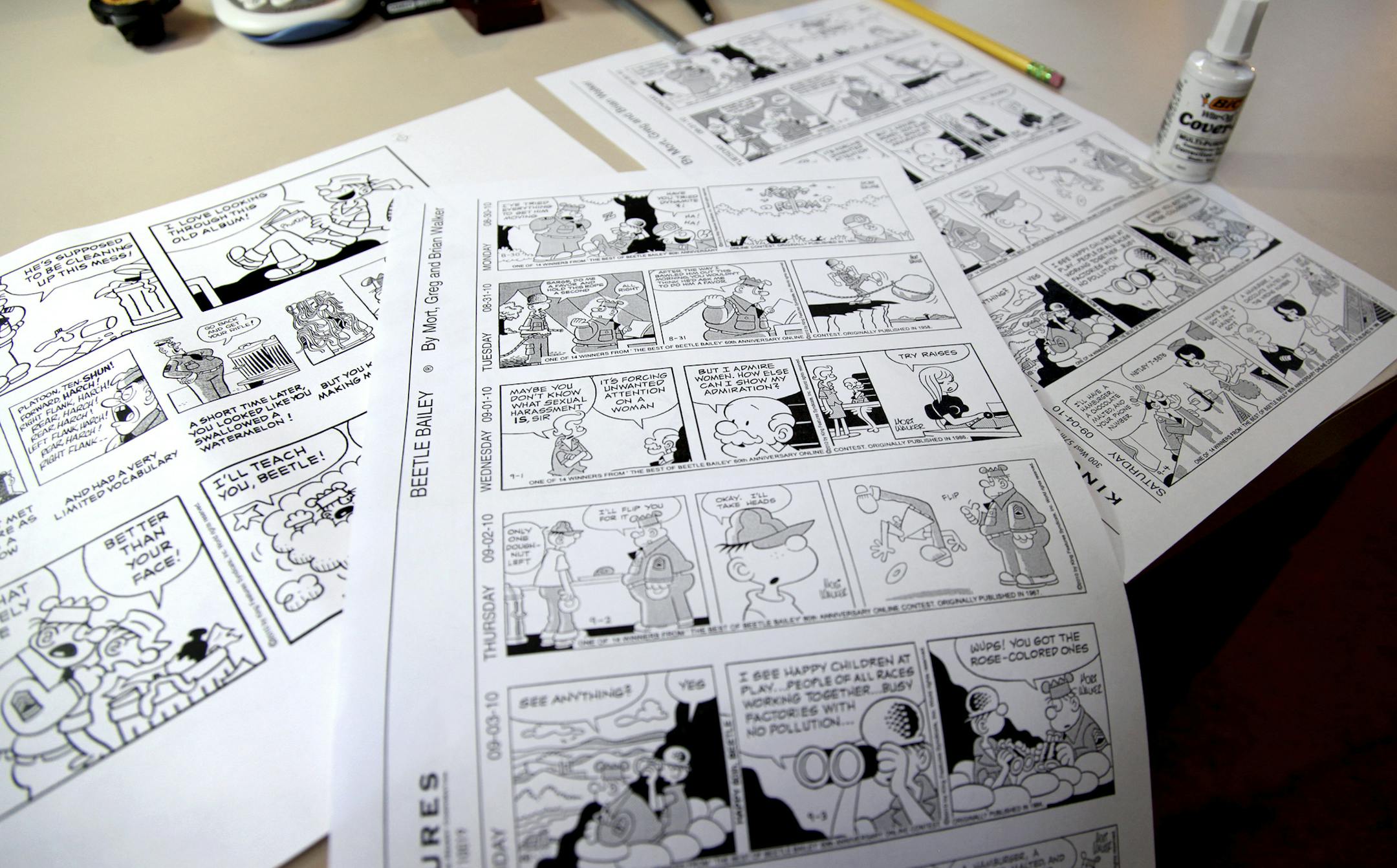 FILE - In this Aug. 16, 2010 file photo, Beetle Bailey comic strips that will be published in the coming weeks rest on a desk in the studio of creator Mort Walker in Stamford, Conn. On Saturday, Jan. 27, 2018, a family member said the comic strip artist has died. He was 94. (AP Photo/Craig Ruttle)