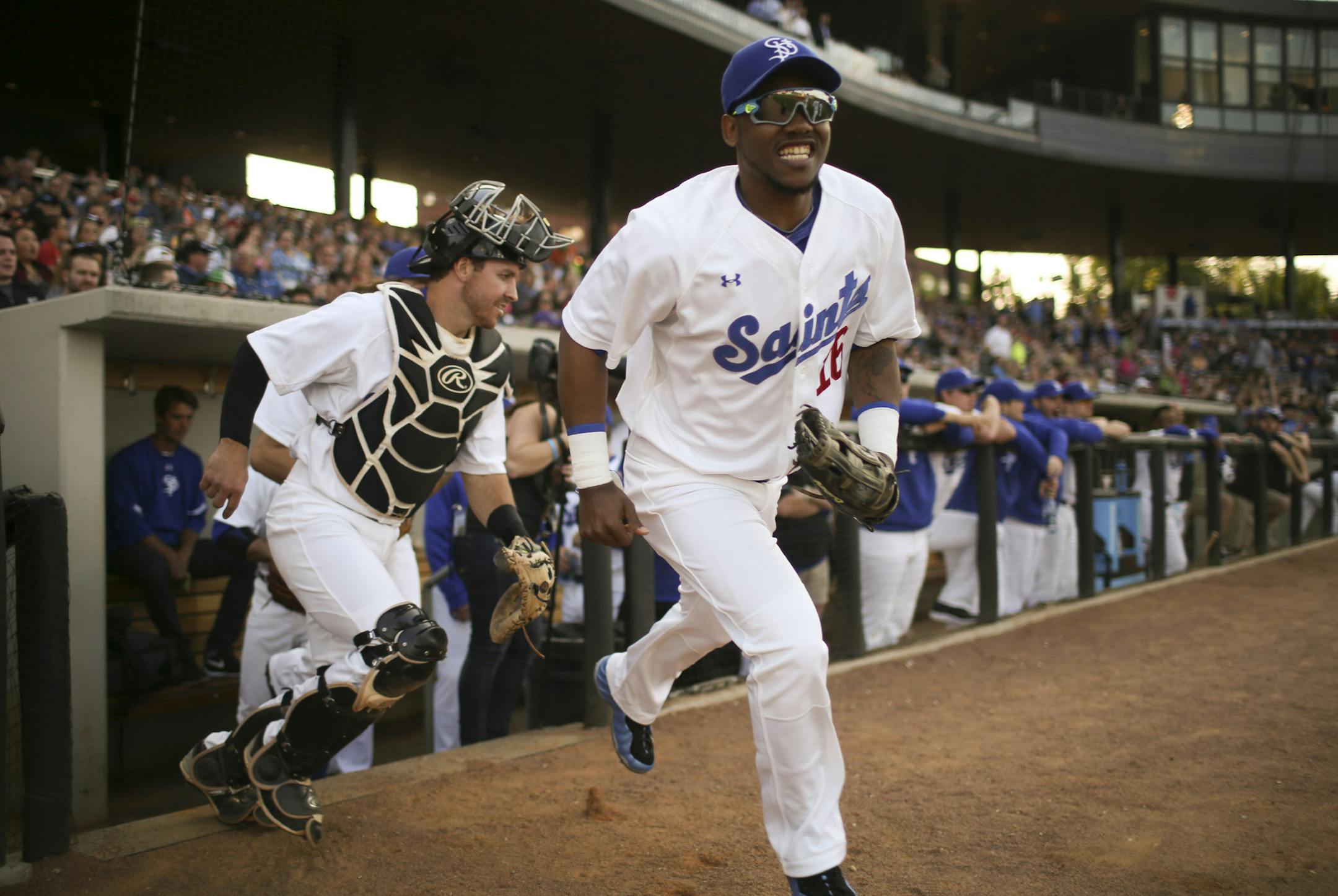 Saints players, including center fielder Alonzo Harris (16) and catcher Tony Caldwell took the field Thursday night. ] JEFF WHEELER ï jeff.wheeler@startribune.com The St. Paul Saints faced the Gary SouthShore Railcats in their home opener Thursday night, May 19, 2016, at CHS Field in St. Paul.