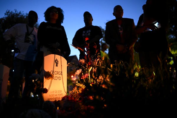 The family of George Floyd congregated around his tombstone at the "Say Their Names Cemetery" in Minneapolis on Thursday.