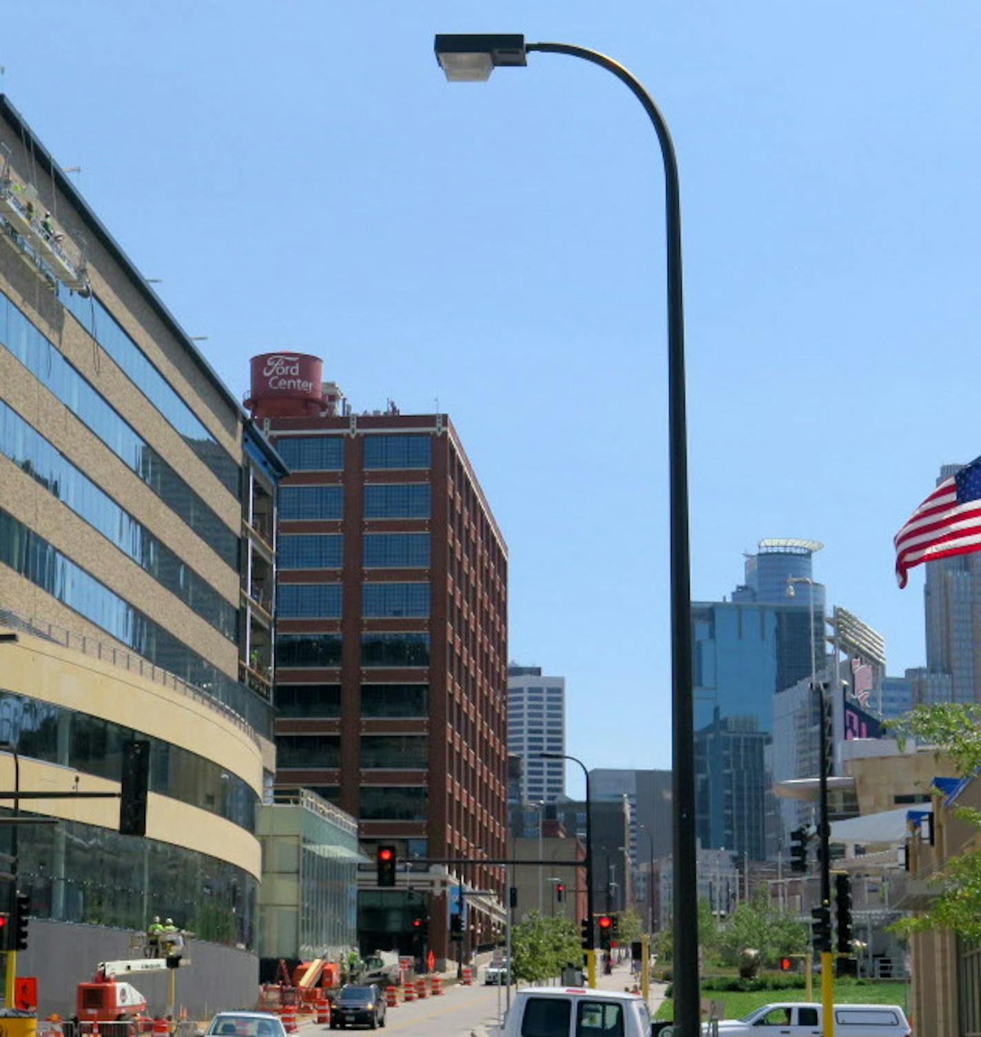 Construction along 5th St North, across from Target Field Station, includes the United Properties building ( center ) that will house " Be The Match ", - the Ford Center, also owned by United Properties ( red brick ) and to the right ( near the flag ) there are plans for another Pohlad / United Properties project.. ] Tom Sweeney, Aug 12 2015, Minneapolis, MN