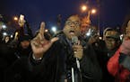 The president of the NAACP Cornell Brooks spoke during a vigil held in front of the Minneapolis Fourth Precinct. Protesters in front of Minneapolis Fo