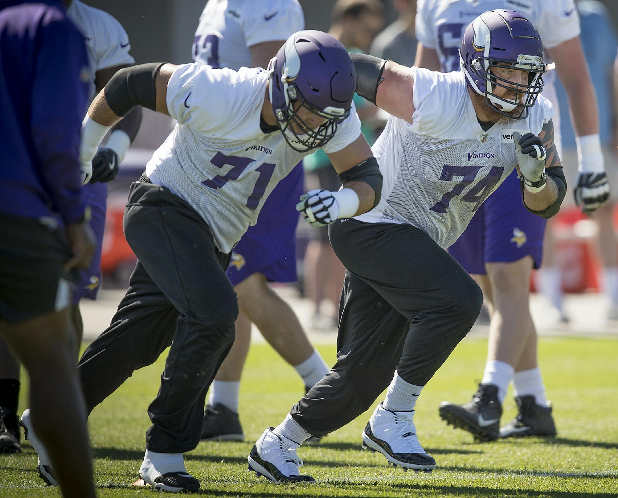 Vikings tackle Mike Remmers, right, ran drills on the field during a mandatory Vikings three-day minicamp at the TCO Performance Center, June 13, 2018 in Eagan, MN.