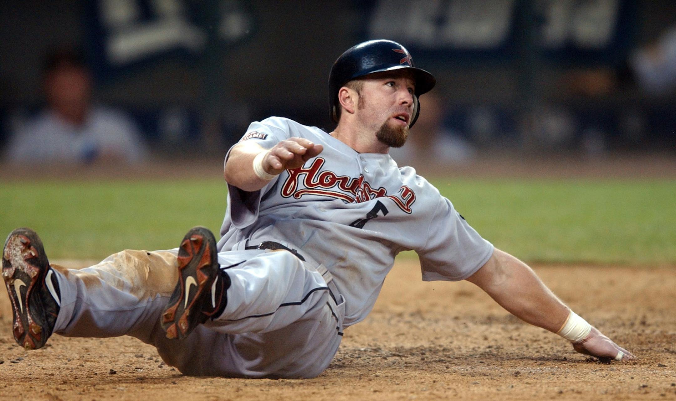 Houston Astros'Jeff Bagwell looks up for the call after crossing home against the Seattle Mariners in the seventh inning Tuesday, June 8, 2004, in Seattle. Bagwell, who singled earlier, scored on the sacrifice fly by Morgan Ensberg. (AP Photo/Elaine Thompson)