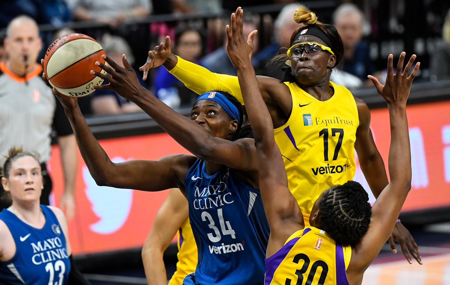 Minnesota Lynx center Sylvia Fowles (34) powered through the defense of Los Angeles Sparks forward Essence Carson (17) and forward Nneka Ogwumike (30) in the first quarter for a layup. ] AARON LAVINSKY &#xef; aaron.lavinsky@startribune.com The Minnesota Lynx played the Los Angeles Sparks on Thursday, July 5, 2018 at Target Center in Minneapolis, Minn.