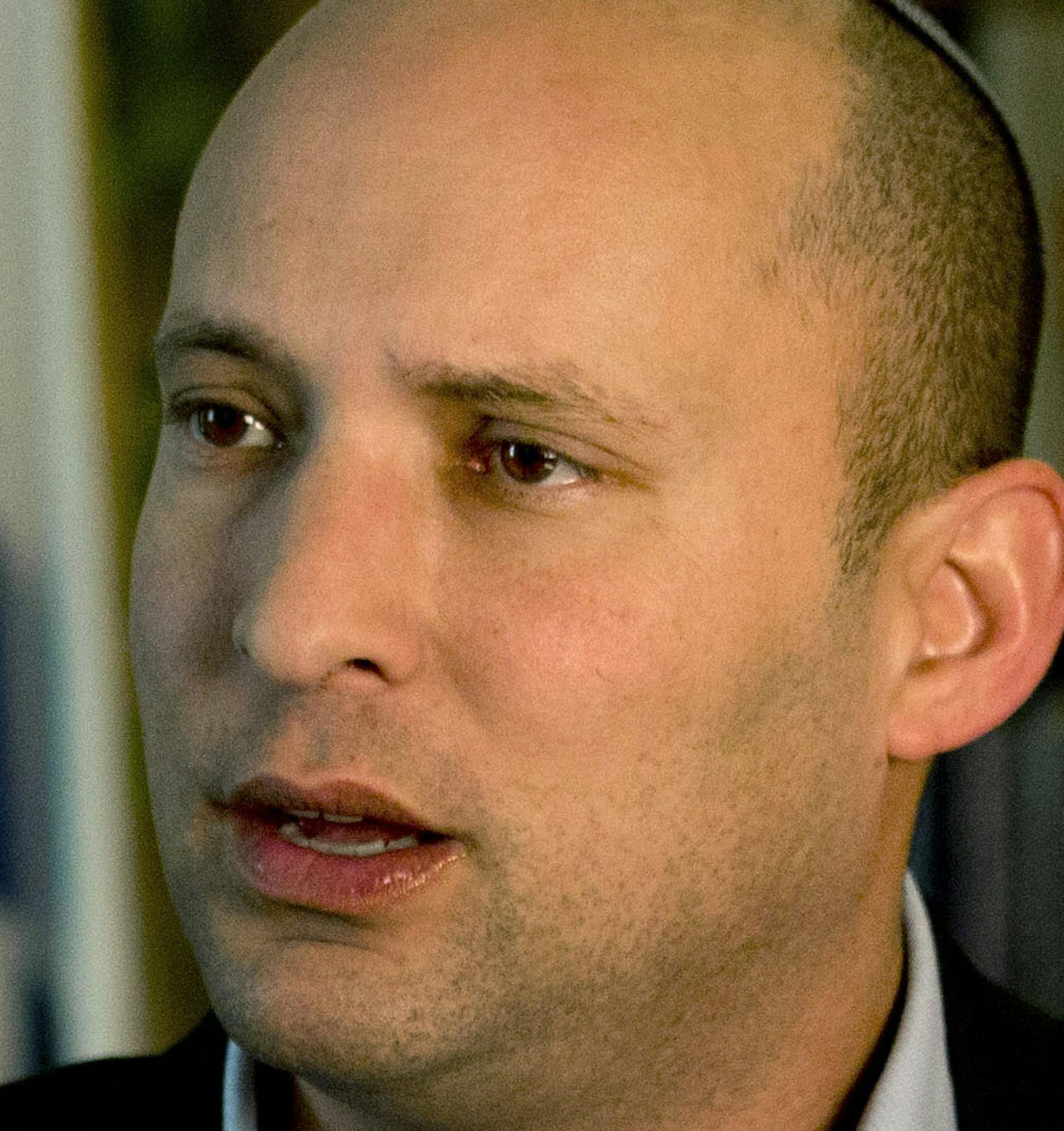Naftali Bennett, leader of the Jewish Home party, speaks during an interview to the Associated Press in Jerusalem, Monday, Feb. 16, 2015. With Benjamin Netanyahu under fire internationally for his hardline policies, a key partner of Israeli prime minister is standing firmly behind him ahead of the March parliamentary elections heralding what could be an even tougher stance toward the Palestinians if they sit together in the next government. (AP Photo/Tsafrir Abayov)