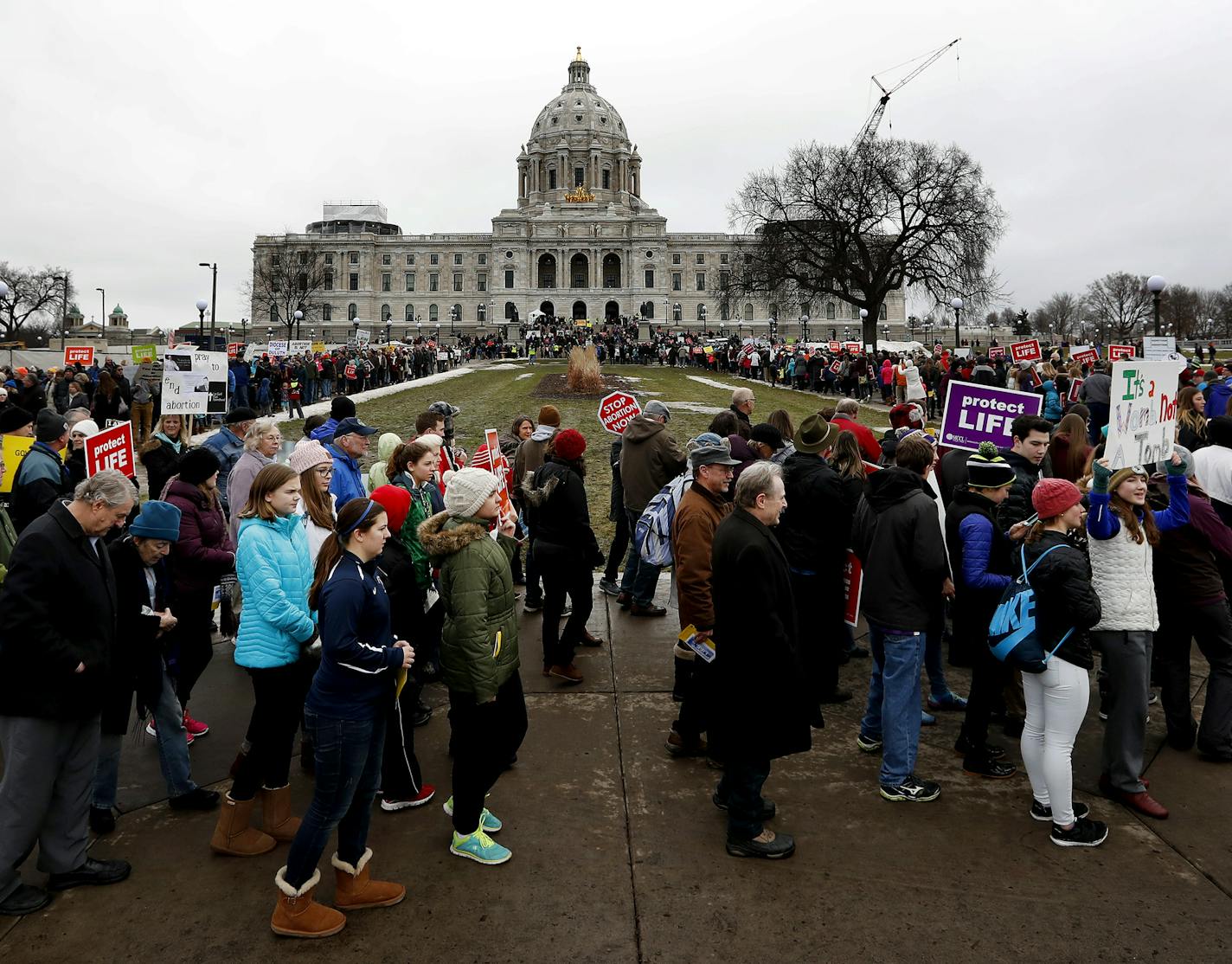 Marchers made their way around the Capitol Mall. Minnesota Citizens Concerned for Life (MCCL) held a march in front of the Minnesota State Capitol on Sunday. ] CARLOS GONZALEZ cgonzalez@startribune.com - January 22, 2017, St. Paul, MN, Minnesota State Capitol, Minnesota Citizens Concerned for Life holds its yearly March for Life rally on the grounds of the State Capitol, to mark the anniversary of the Supreme Court's Roe v. Wade decision.