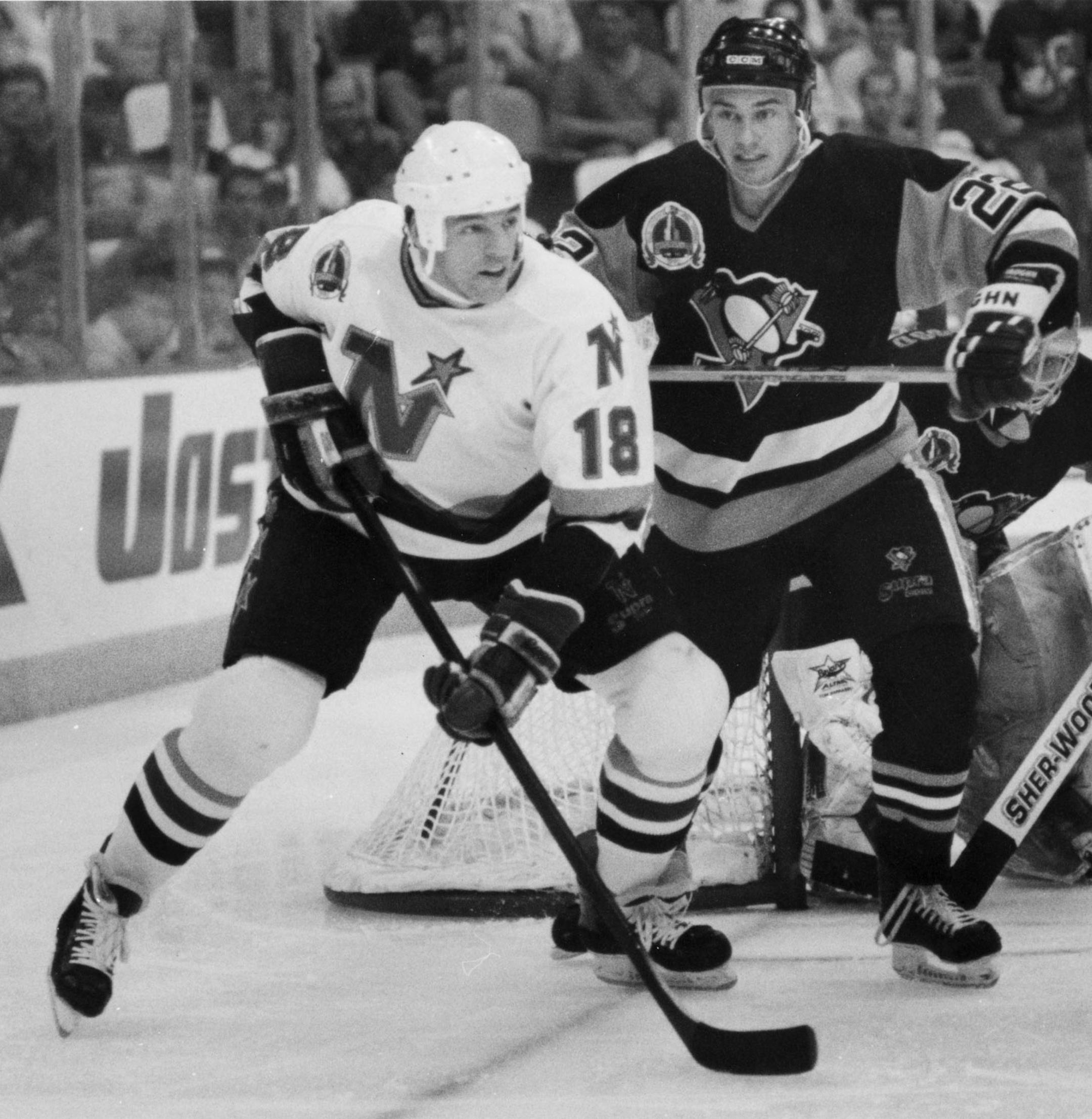 Bobby Smith jockey's for position with Pittsburgh's Paul Stanton in game 6 of the 1991 Stanley Cup finals.