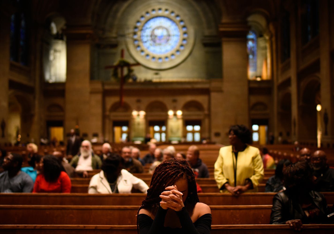 Nadia Alsherif, of Minneapolis, bowed her head for a personal prayer from the Book of Hebrews before the start of Friday night's service honoring the Rev. Dr. Martin Luther King Jr. Alsherif read Amos 5:22-24 as part of the service. ] AARON LAVINSKY &#xef; aaron.lavinsky@startribune.com About 100 folks packed the Basilica of St. Mary Friday night in a belated celebration of civil rights leader Martin Luther King &#xf3; and also to demonstrate a growing alliance between Minnesota&#xed;s historic