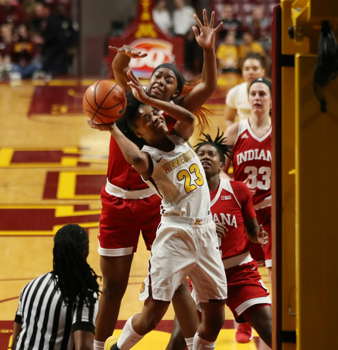 Indiana Hoosiers forward Kym Royster (11) fouled Minnesota Golden Gophers guard Kenisha Bell (23) in the first half at Williams Arena Tuesday Feb 20, 2018 in Minneapolis, MN.] Minnesota hosted Indiana at Williams Arena . JERRY HOLT &#xef; jerry.holt@startribune.com