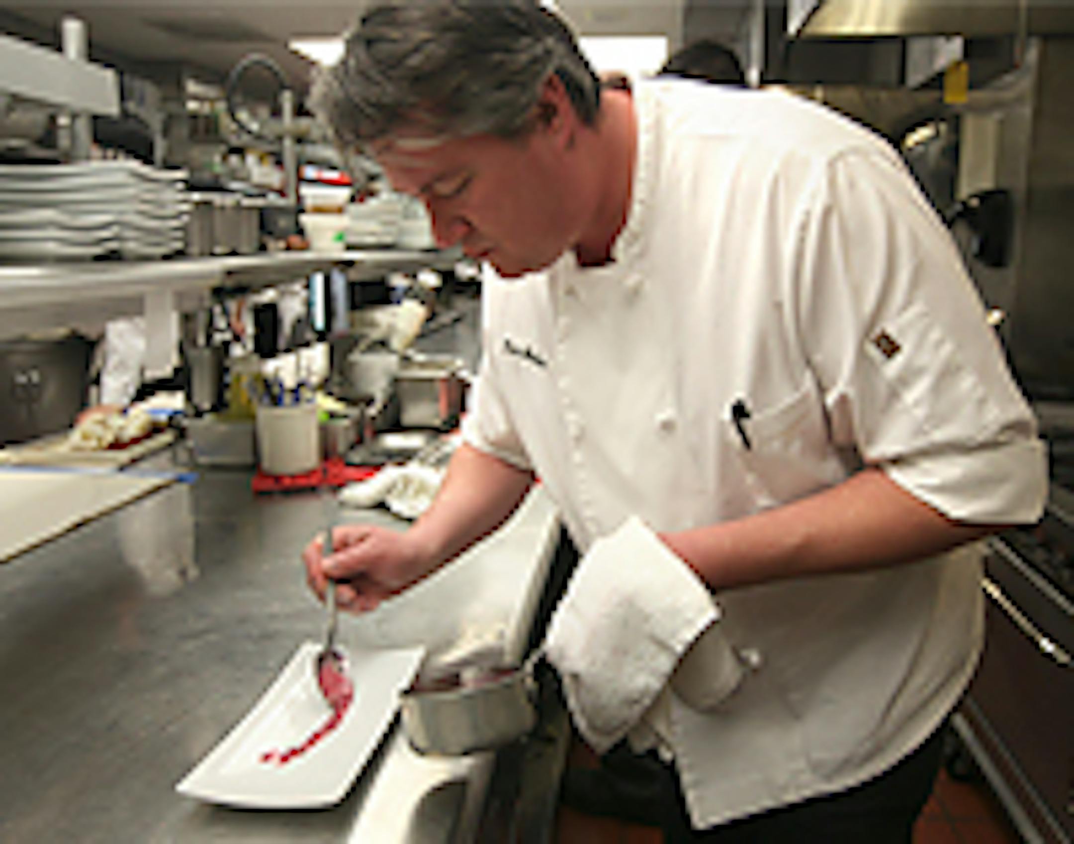 Chef Tim McKee prepares a dish