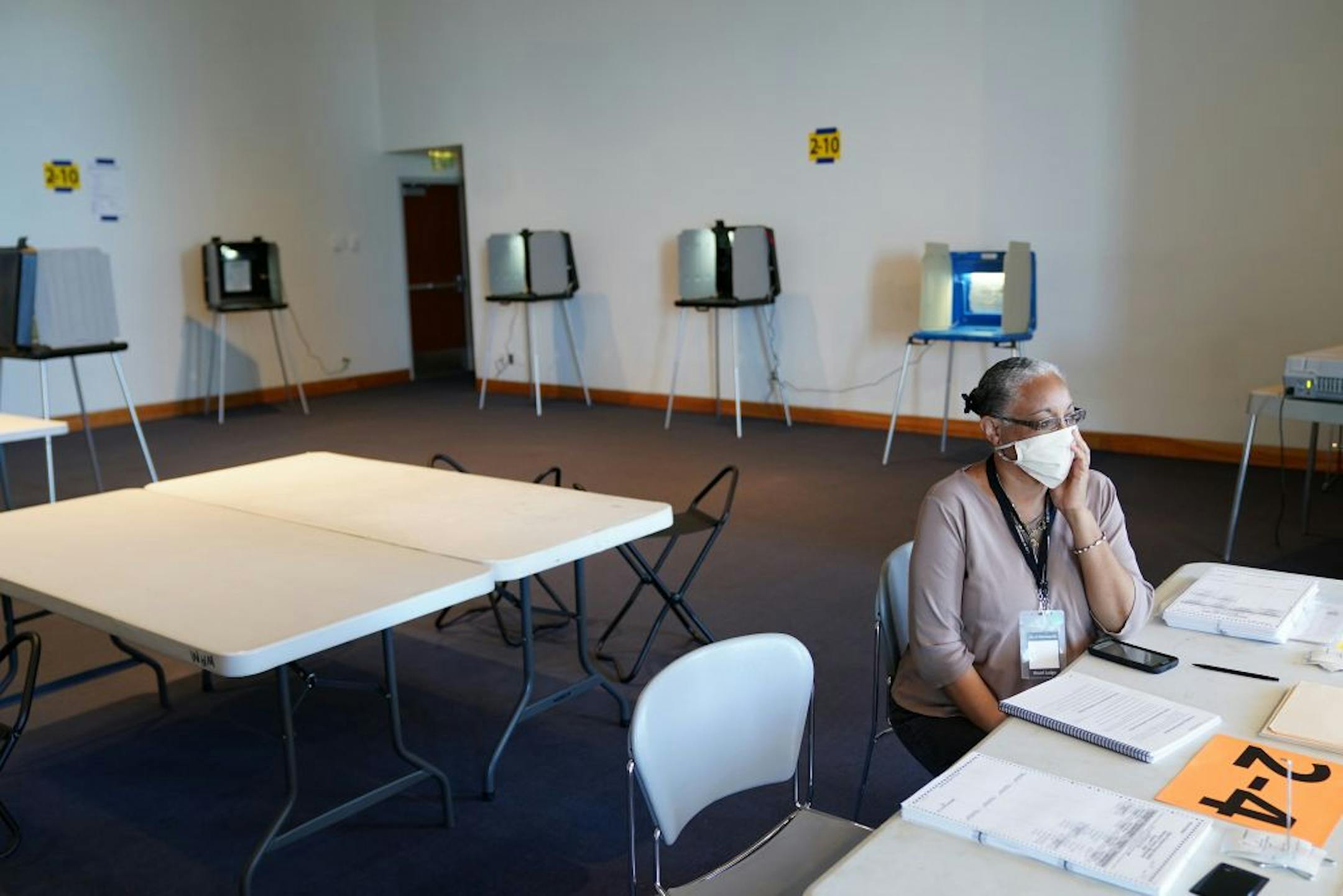 Head election judge Mikki Murray gazed out the window of the Frederick R. Weisman Art Museum on a slow day of voting at the University of Minnesota in Minneapolis.