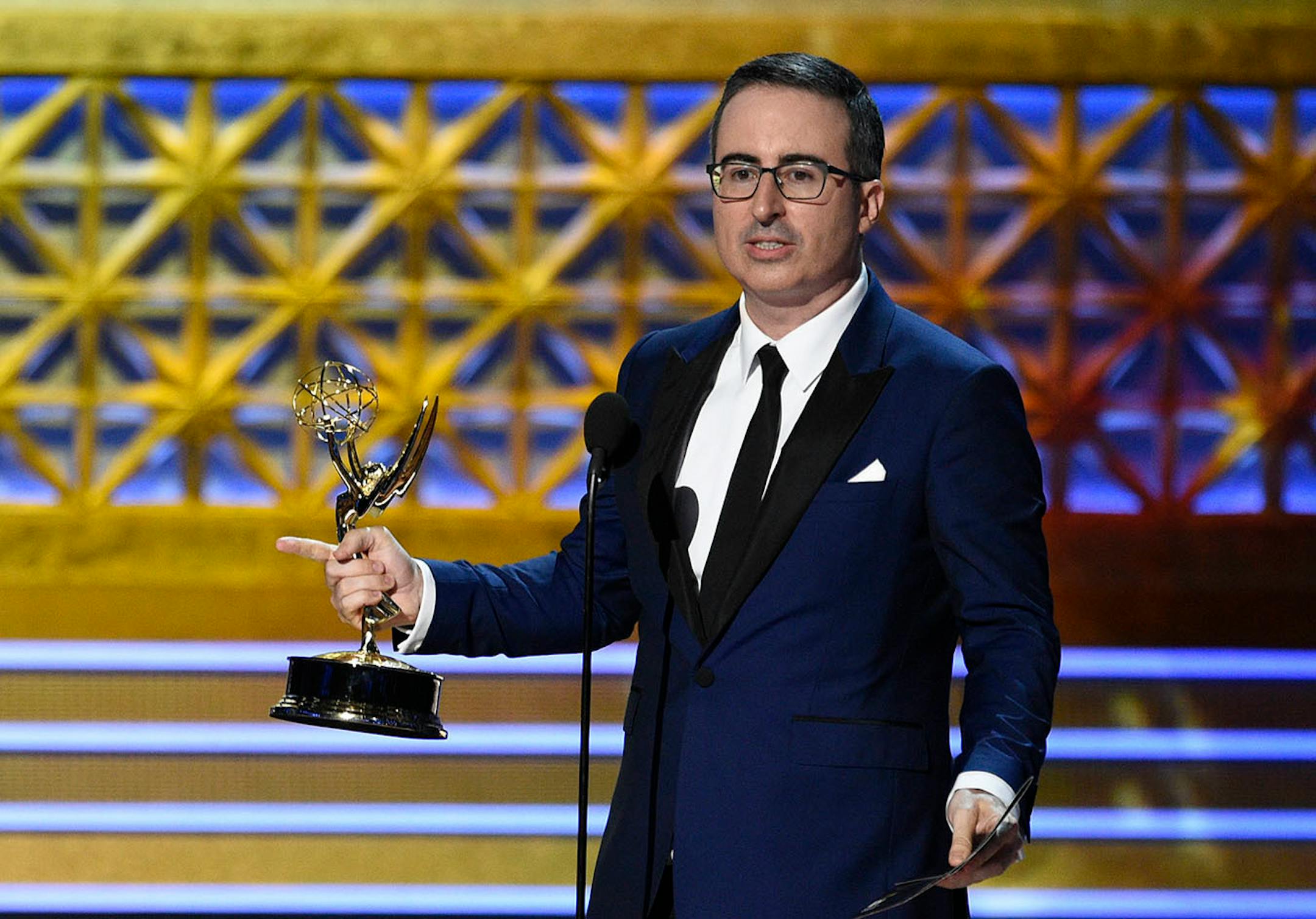 John Oliver accepts the award for outstanding writing for a variety series for "Last Week Tonight with John Oliver" at the 69th Primetime Emmy Awards on Sunday, Sept. 17, 2017, at the Microsoft Theater in Los Angeles.
