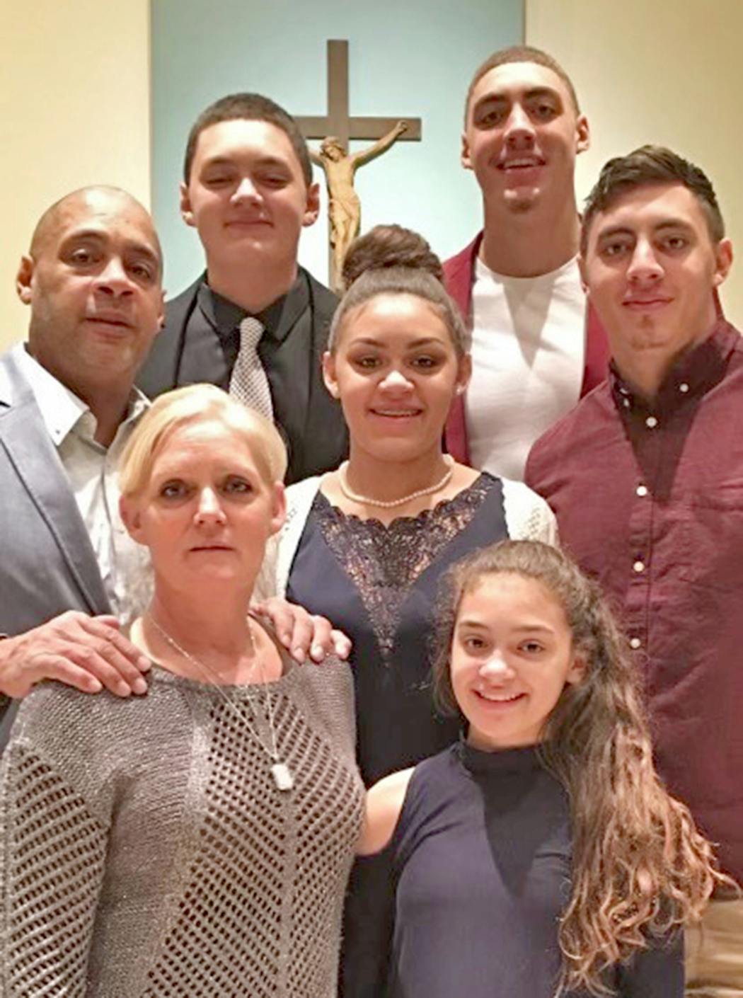 The Travis family: Mom Jackie is front left, and going clockwise it’s father Nate, Jalen, Reid, Jonah, Olivia in the middle and Grace in front.