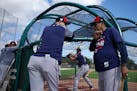 Minnesota Twins manager Rocco Baldelli (5) chatted with hall of famer Rod Carew (29) as they watched batting practice Sunday. ] ANTHONY SOUFFLE • an