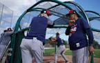 Minnesota Twins manager Rocco Baldelli (5) chatted with hall of famer Rod Carew (29) as they watched batting practice Sunday. ] ANTHONY SOUFFLE • an