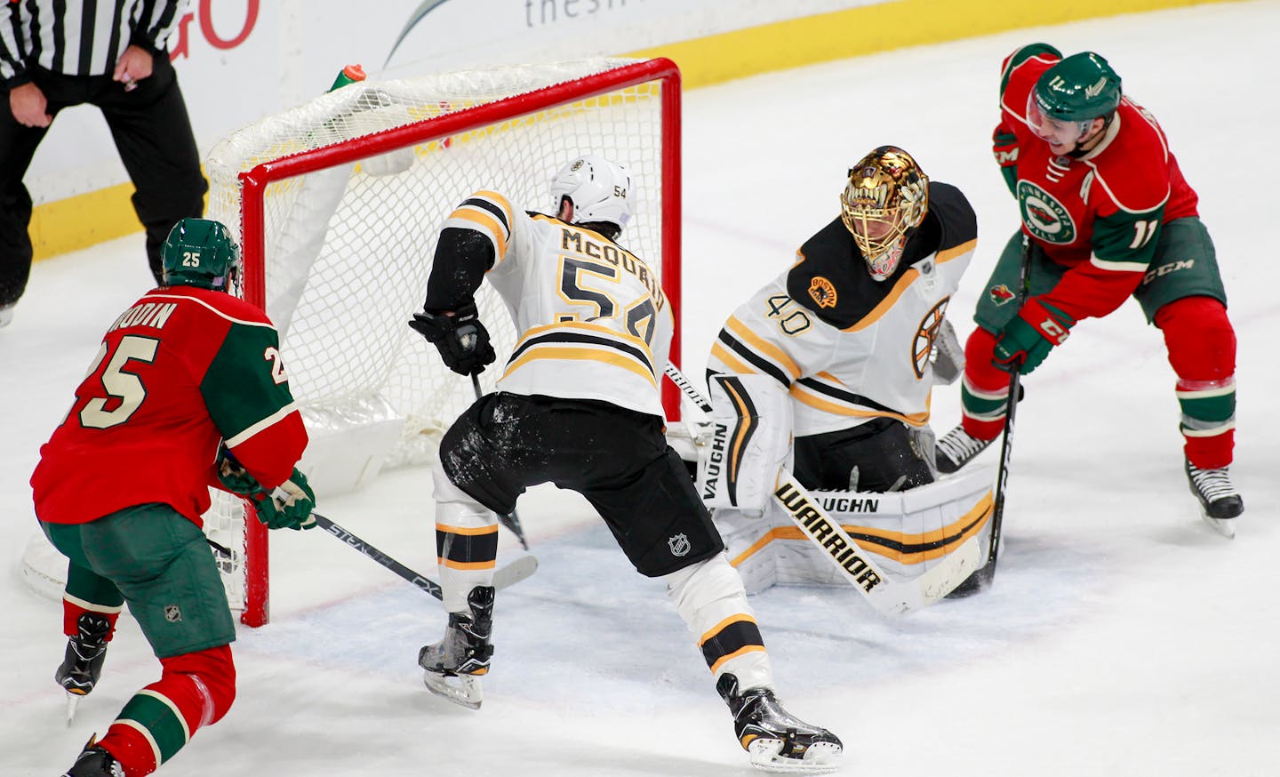 Minnesota Wild defenseman Jonas Brodin, of Sweden (25) and the Wilds' Zach Parise watch as teammate Mikael Granlund's, not pictured, scores against Boston Bruins goalie Tuukka Rask, of Finland (40) during the third period of an NHL hockey game, Thursday, Nov. 17, 2016, in St. Paul, Minn. Boston Bruins' Adam McQuaid defends on the play. Minnesota won 1-0. (AP Photo/Paul Battaglia)